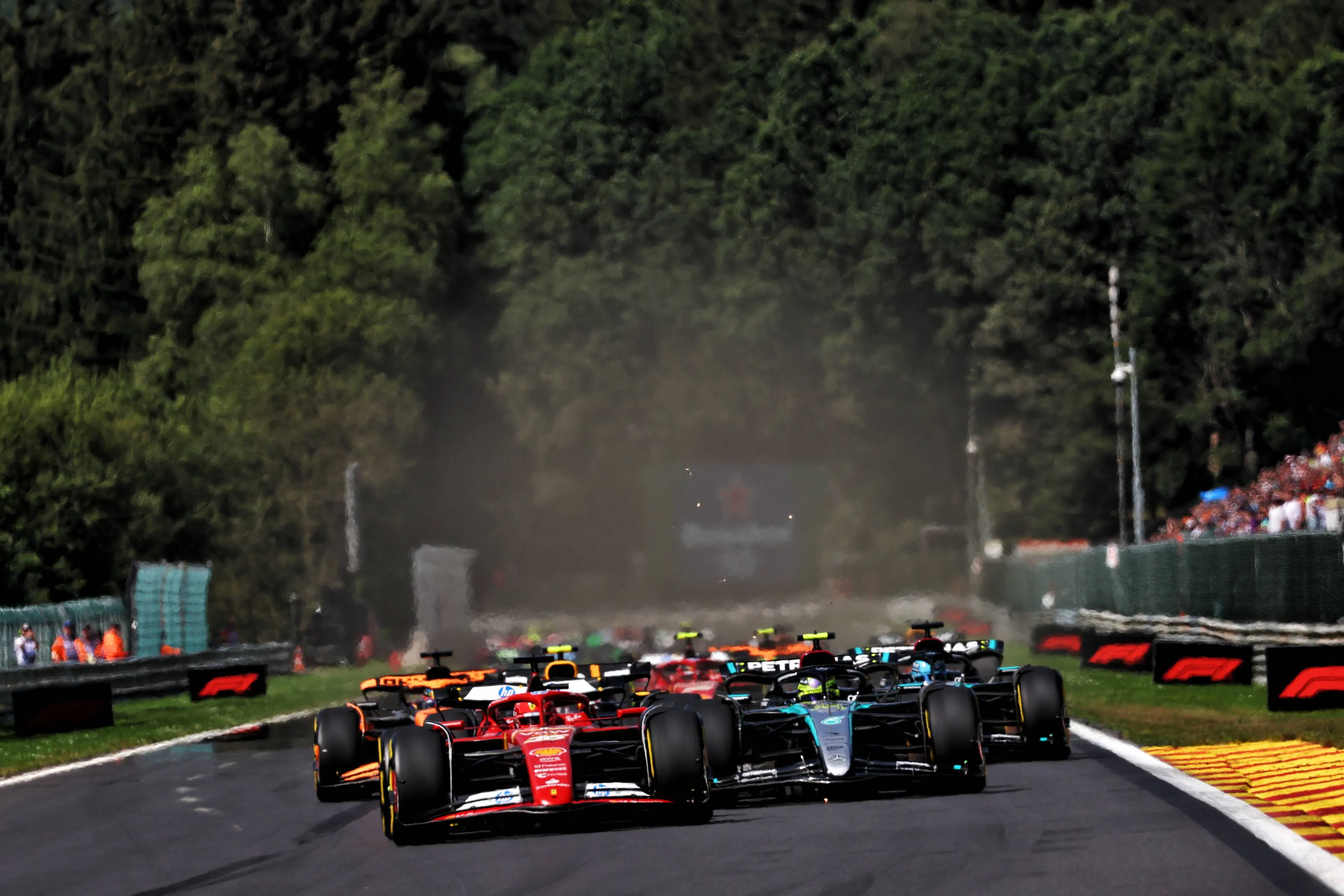 The F1 drivers roar past the Kemmel straight at Spa