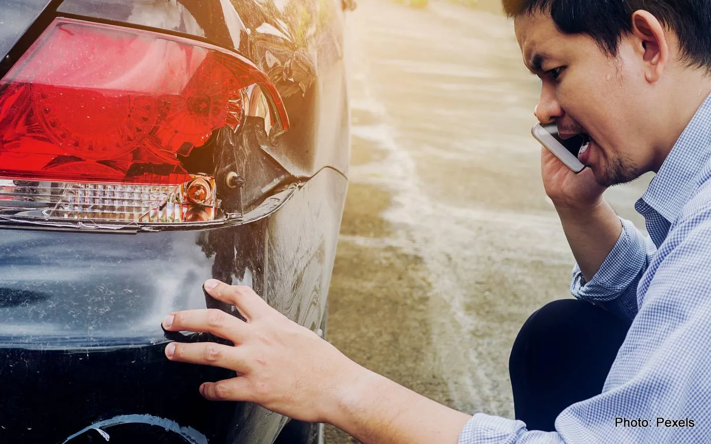 man-is-calling-insurrance-company-claiming-his-car-crash-damaged-road-accident-001
