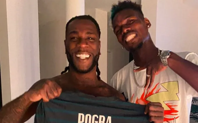Paul Pogba feestend gespot met Burna Boy na uitschakeling EK