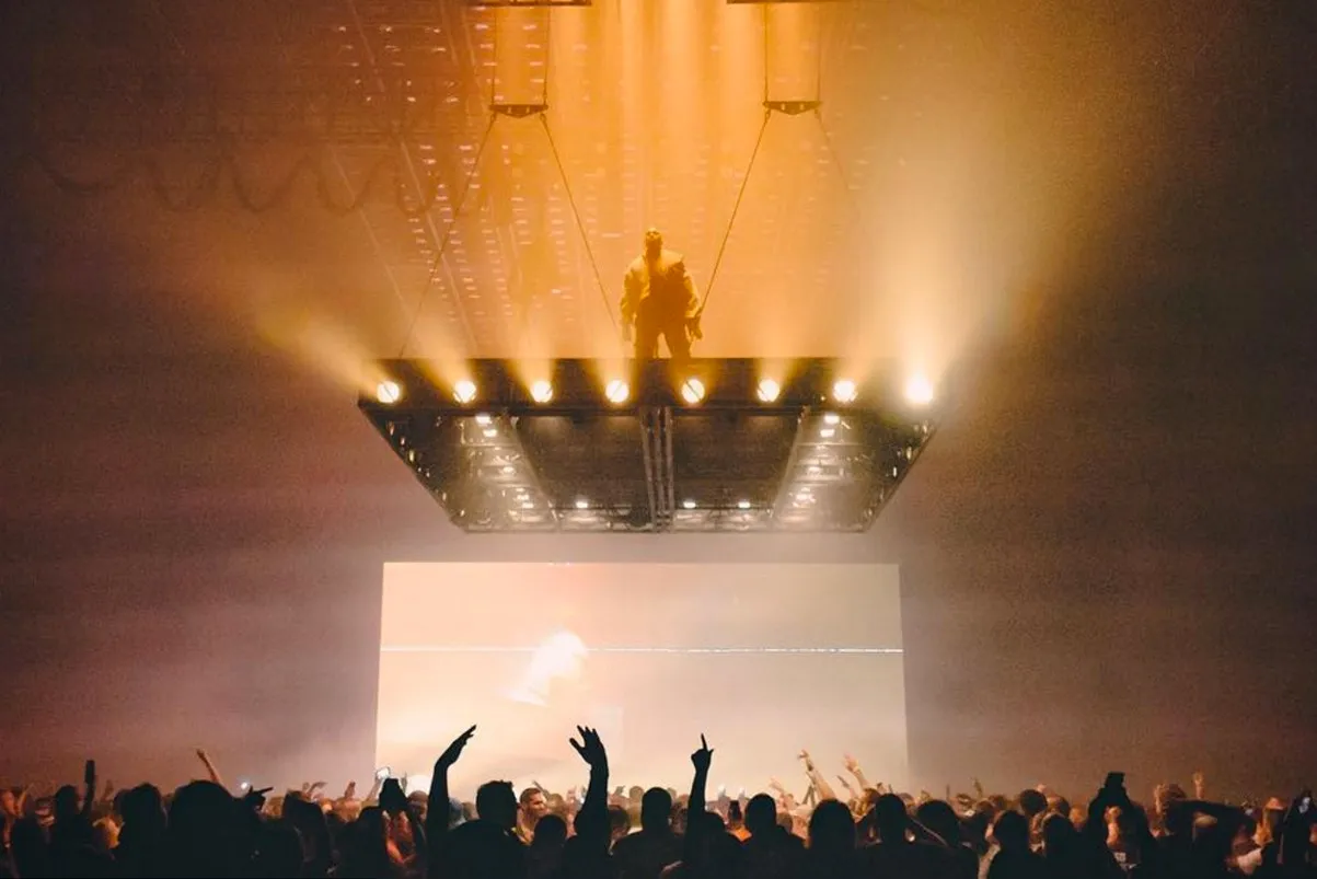 someone climbed kanye wests floating stage