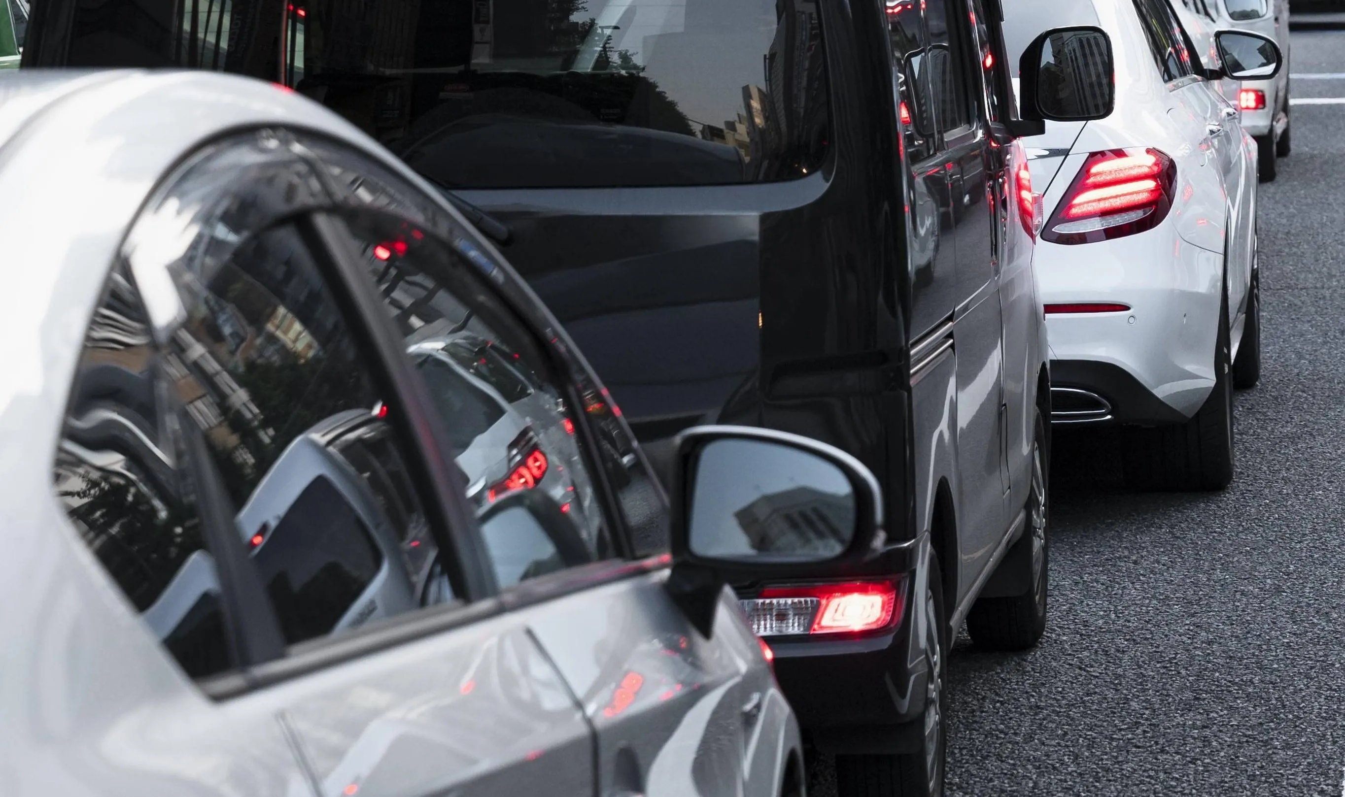 people-driving-cars-city-street