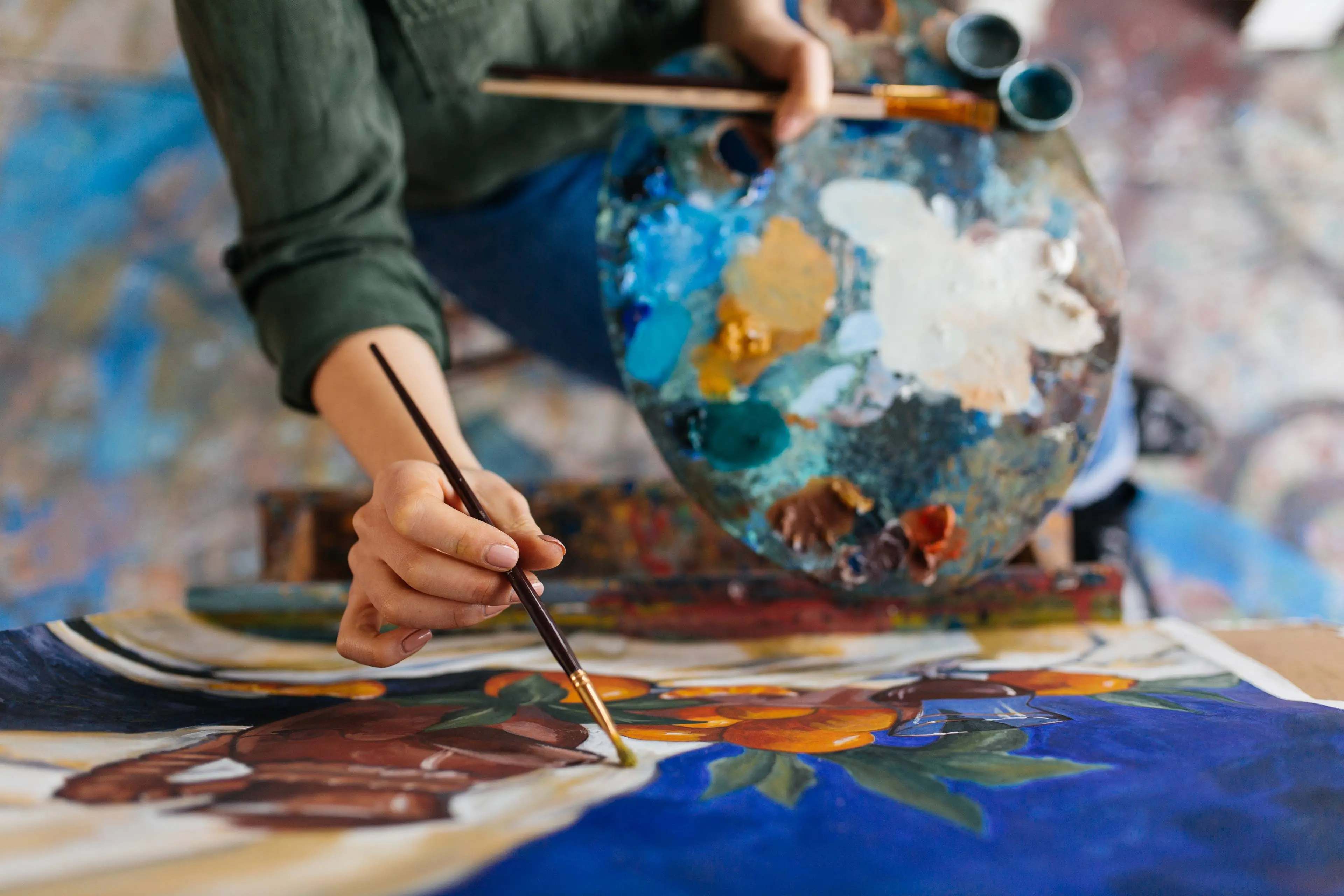 top-view-attractive-woman-hands-drawing-amazing-picture-canvas-modern-cozy-art-workshop