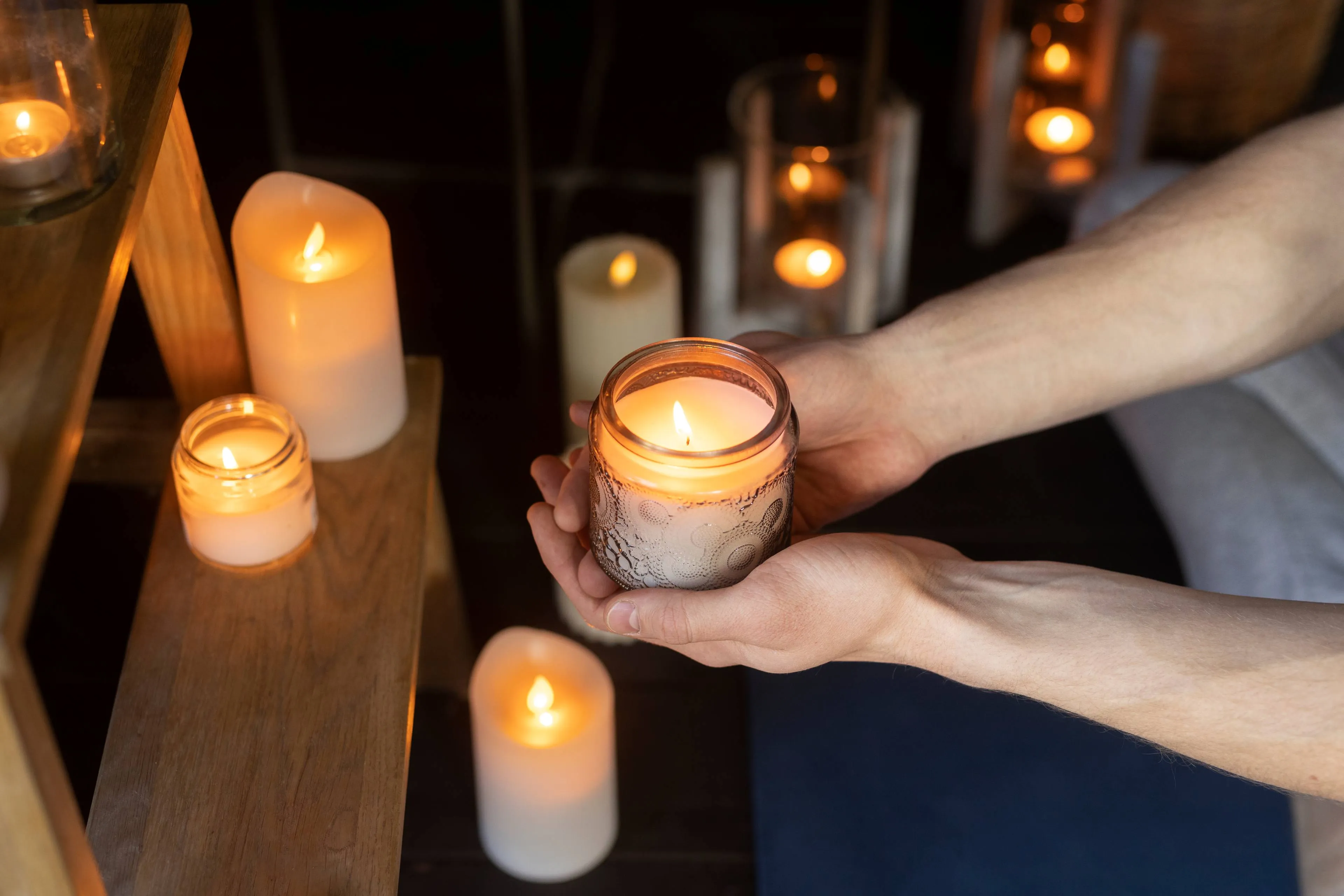 high angle man holding candle