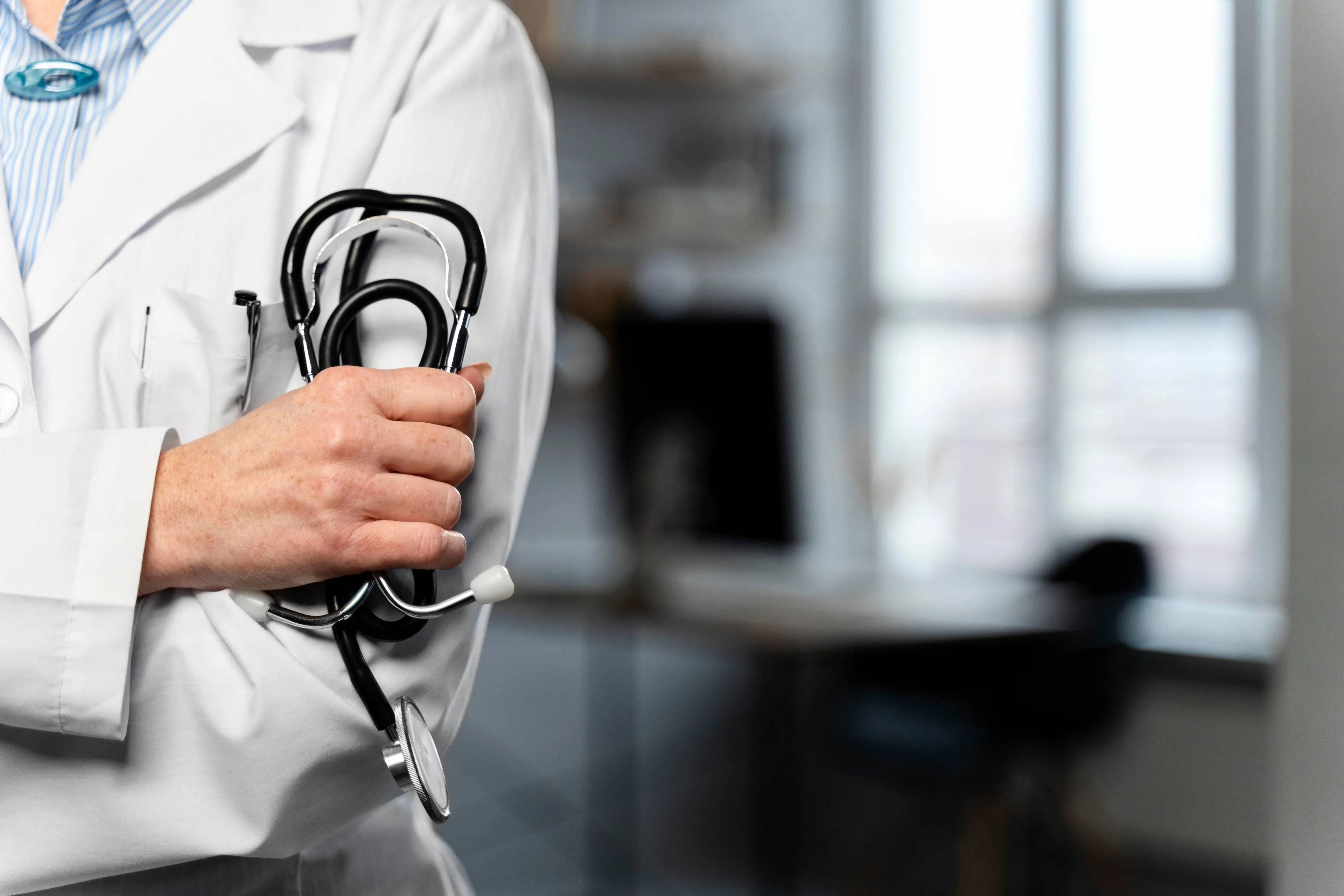 front-view-female-doctor-holding-stethoscope-with-copy-space