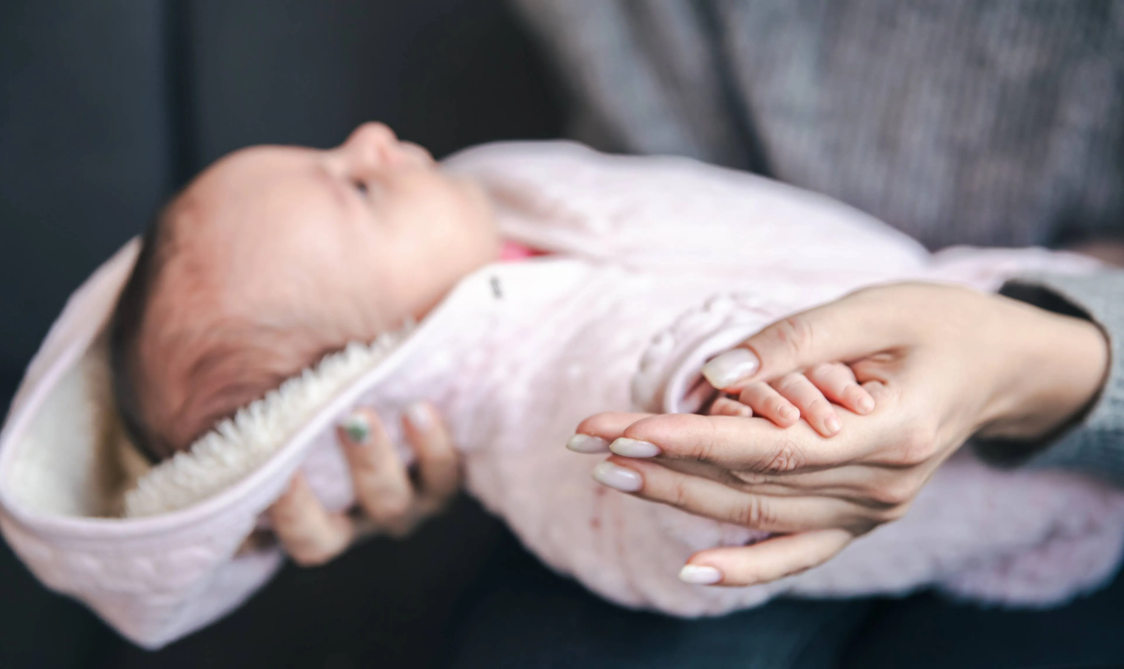 closeup-pen-newborn-baby-girl-moms-hand