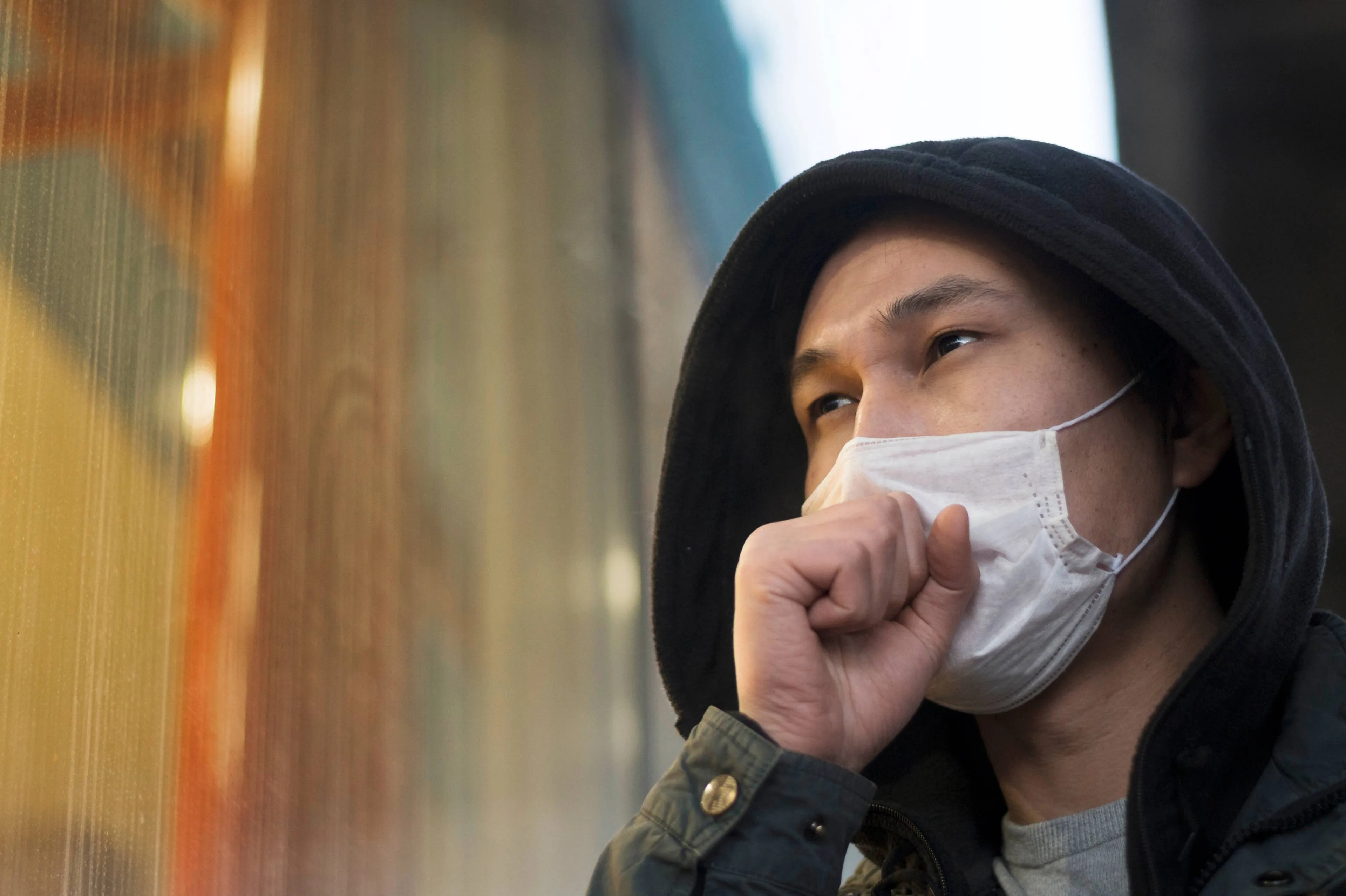 side-view-man-coughing-while-wearing-medical-mask (1)