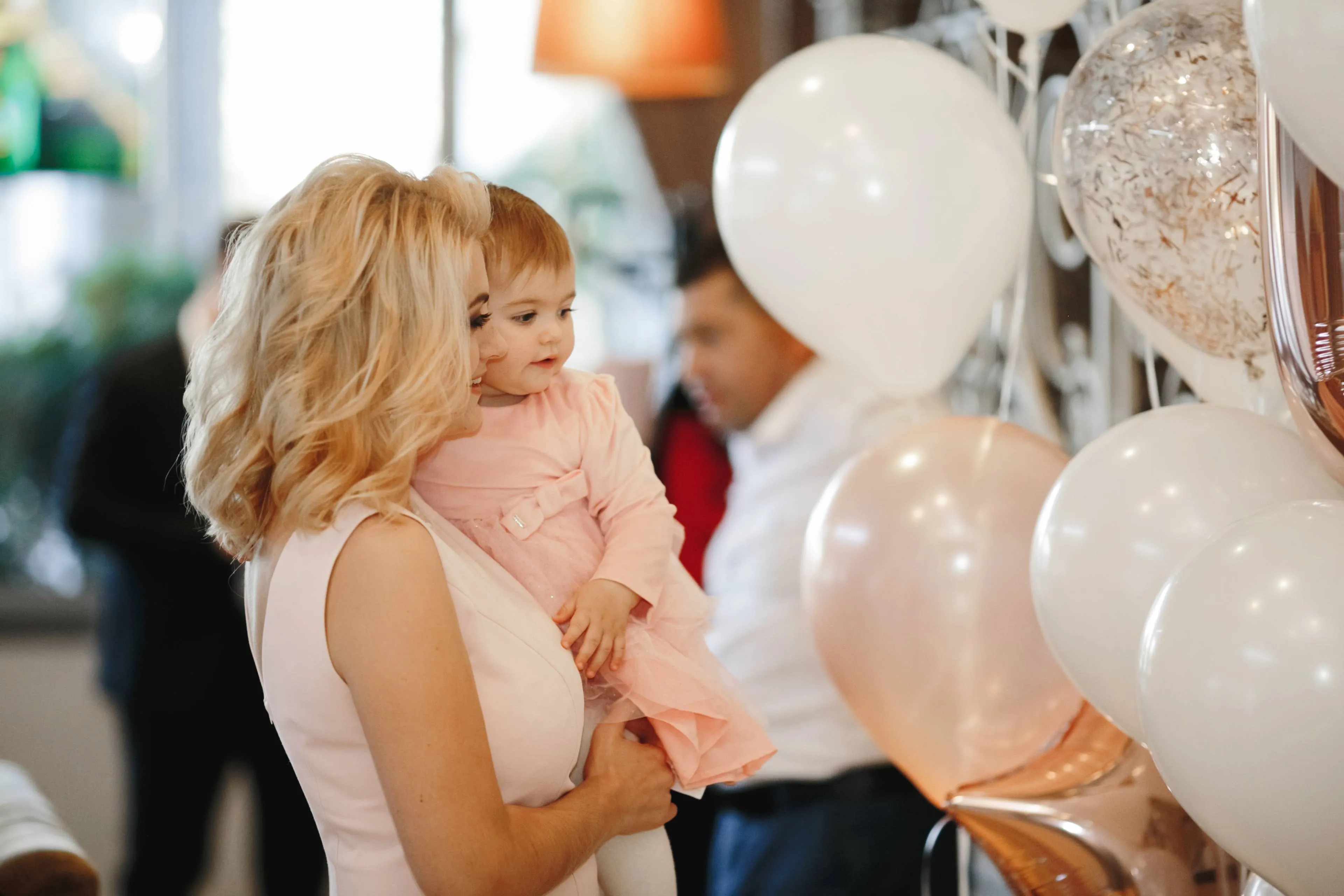 smiling-mother-holds-her-cute-little-daughter
