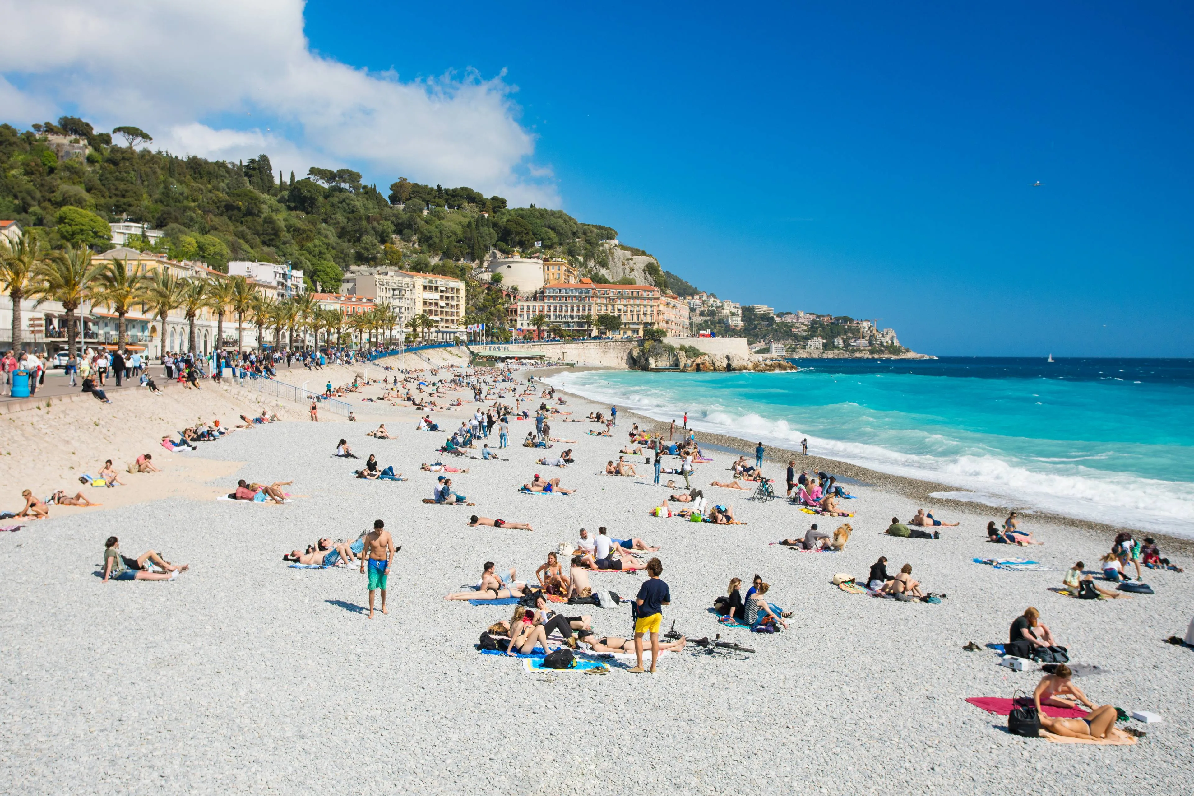 people-sunbathing-relaxing-beach-nice-france