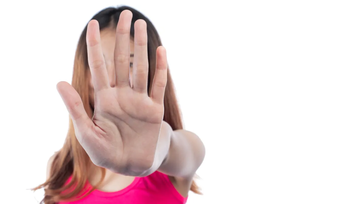 woman making stop gesture with her hand