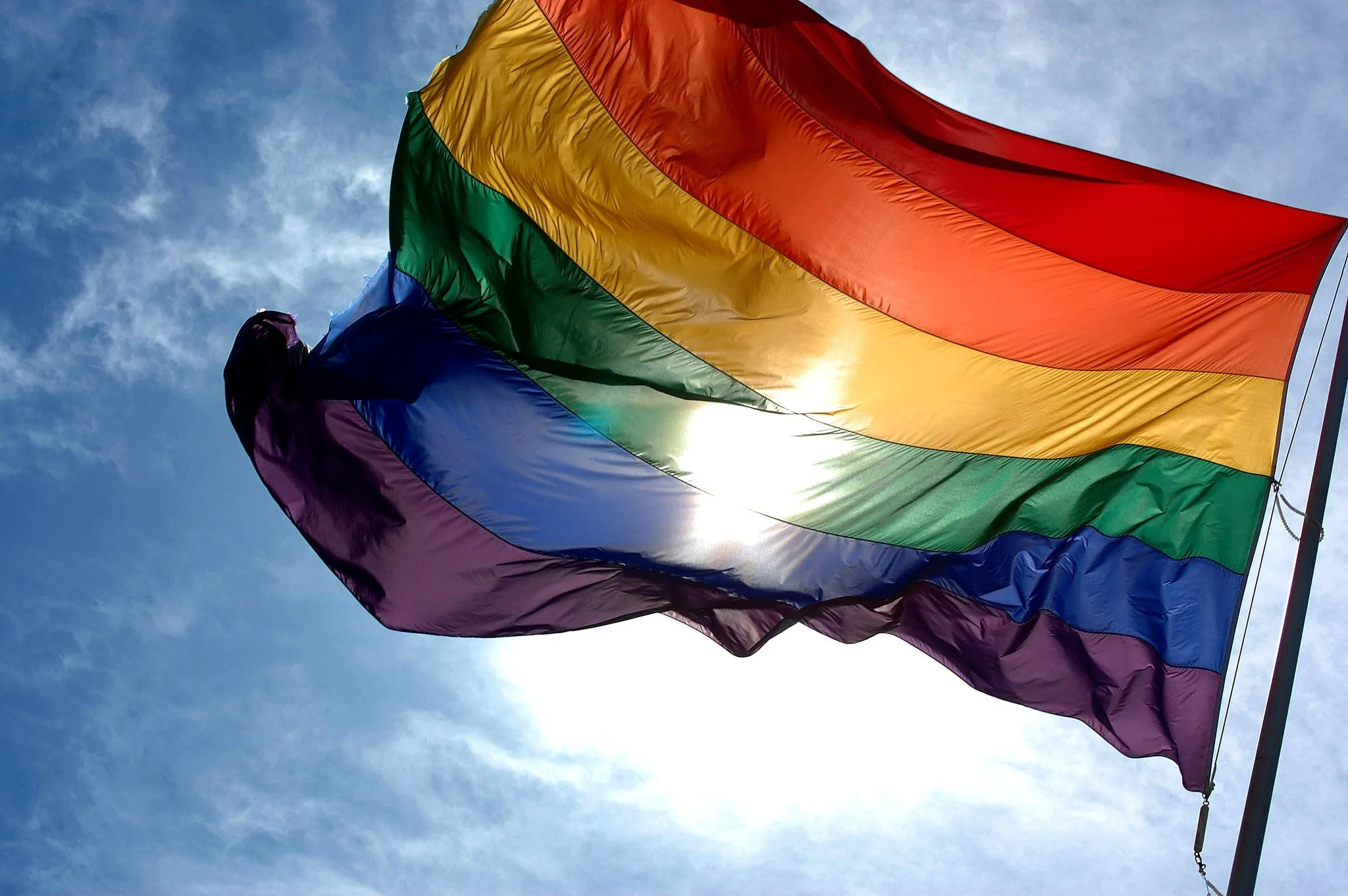 2048px rainbow flag and blue skies