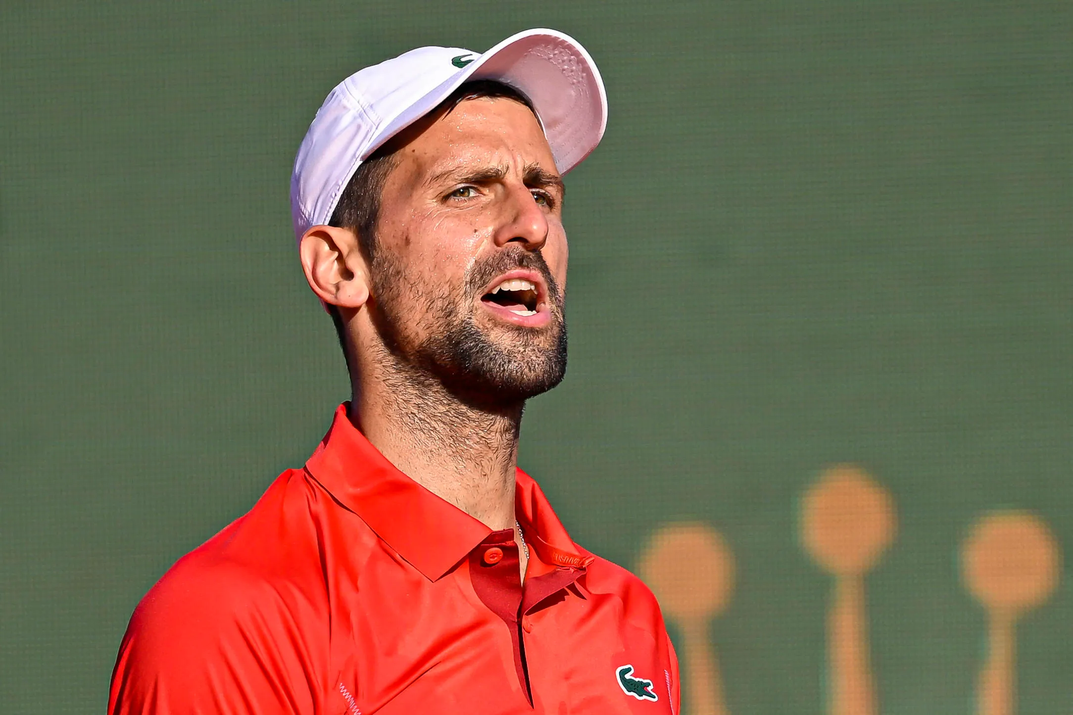 WATCH: Djokovic Returns To Sign Autographs Wearing Bike Helmet After Bottle Incident