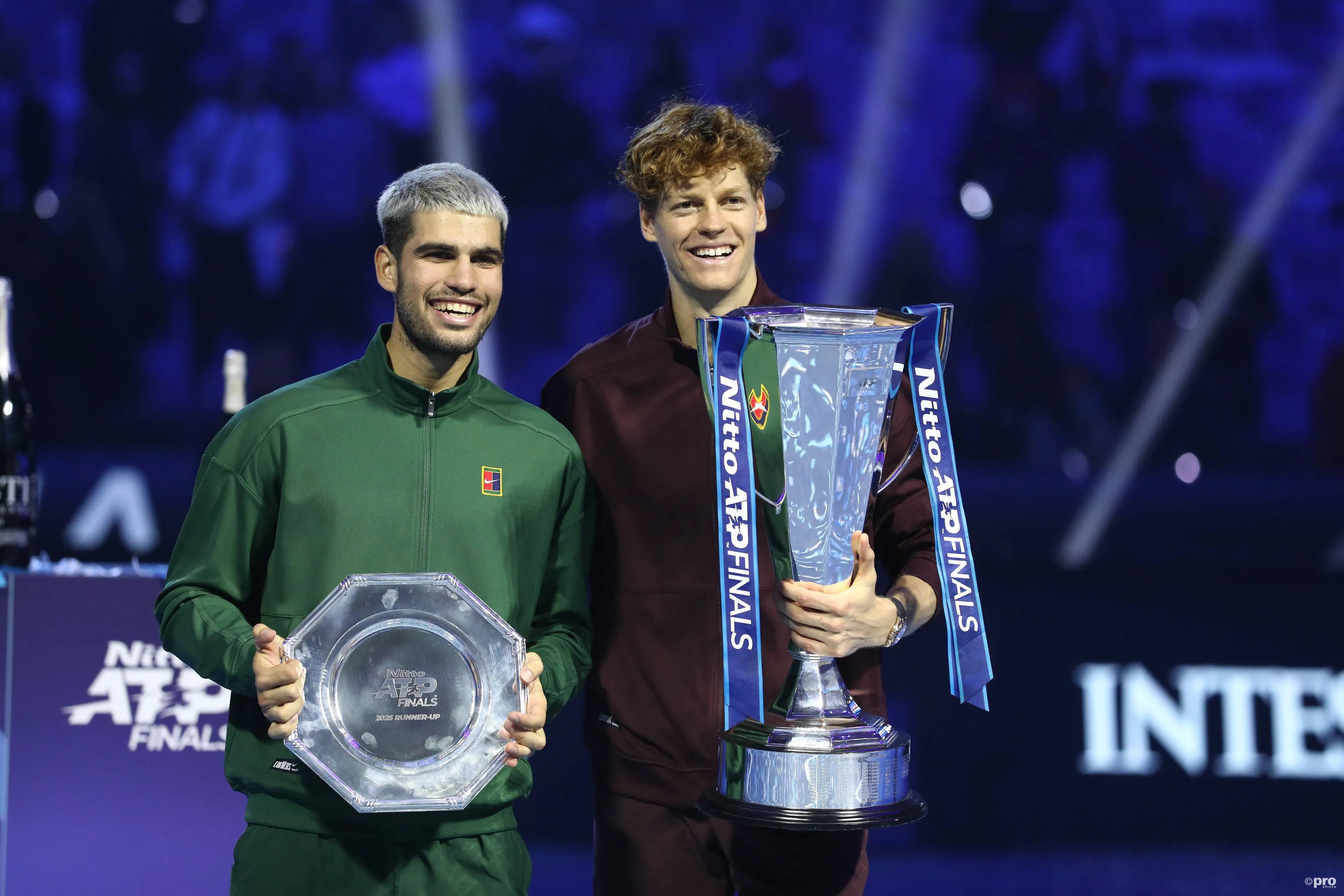 Jannik Sinner proudly holds the ATP Finals trophy alongside Carlos Alcaraz in 2025