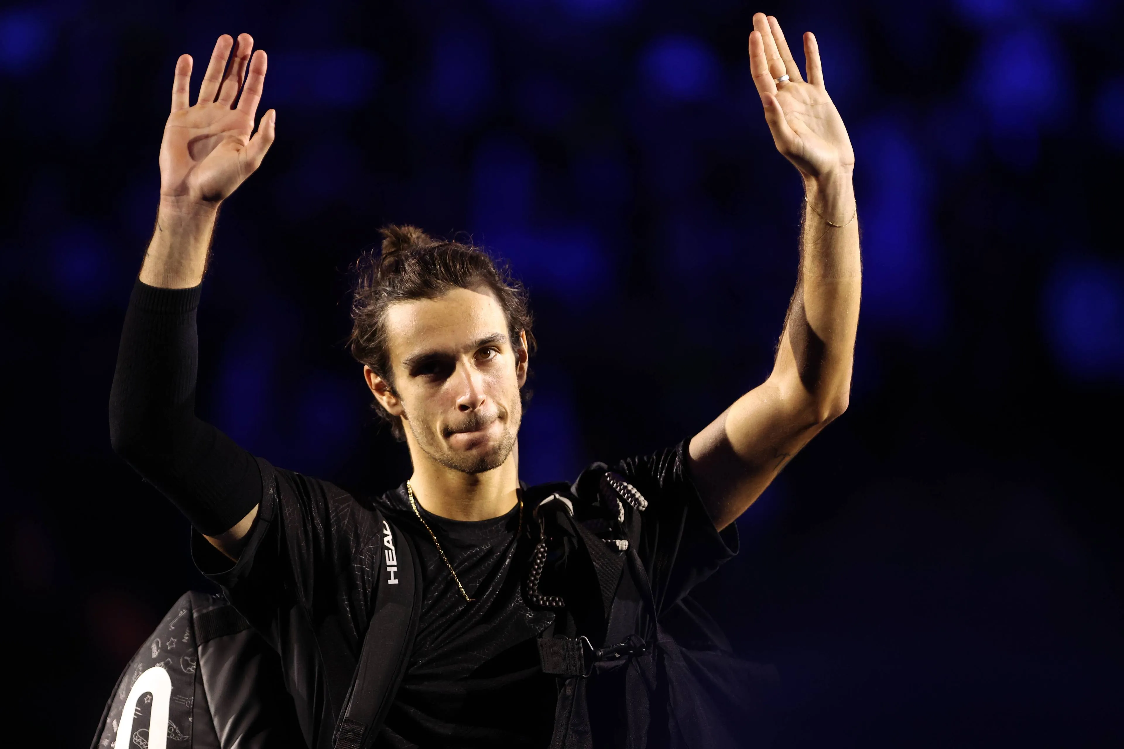Lorenzo Musetti walking away from the 2025 ATP Finals in Turin