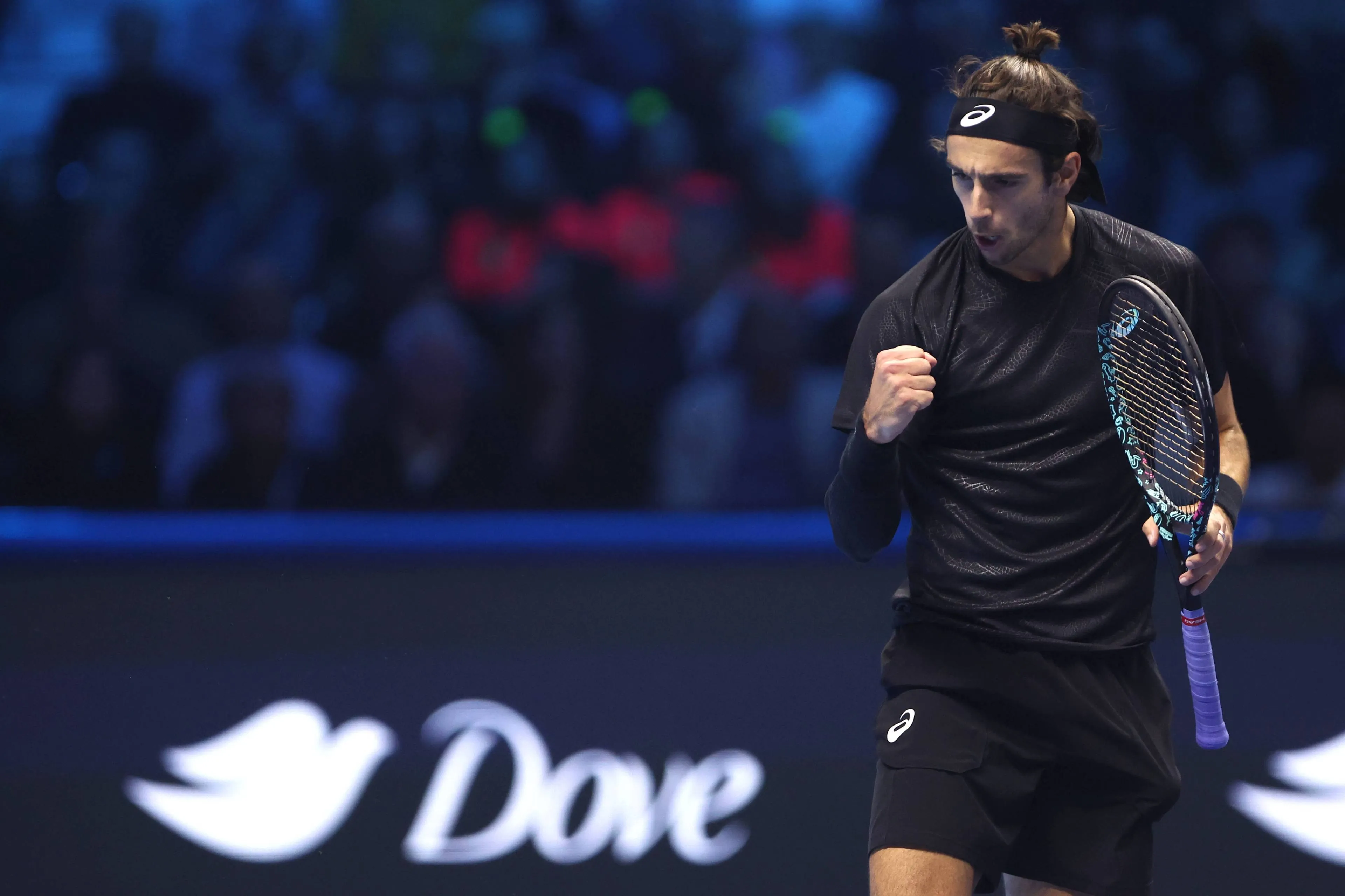 Lorenzo Musetti fist pumps during ATP Finals.