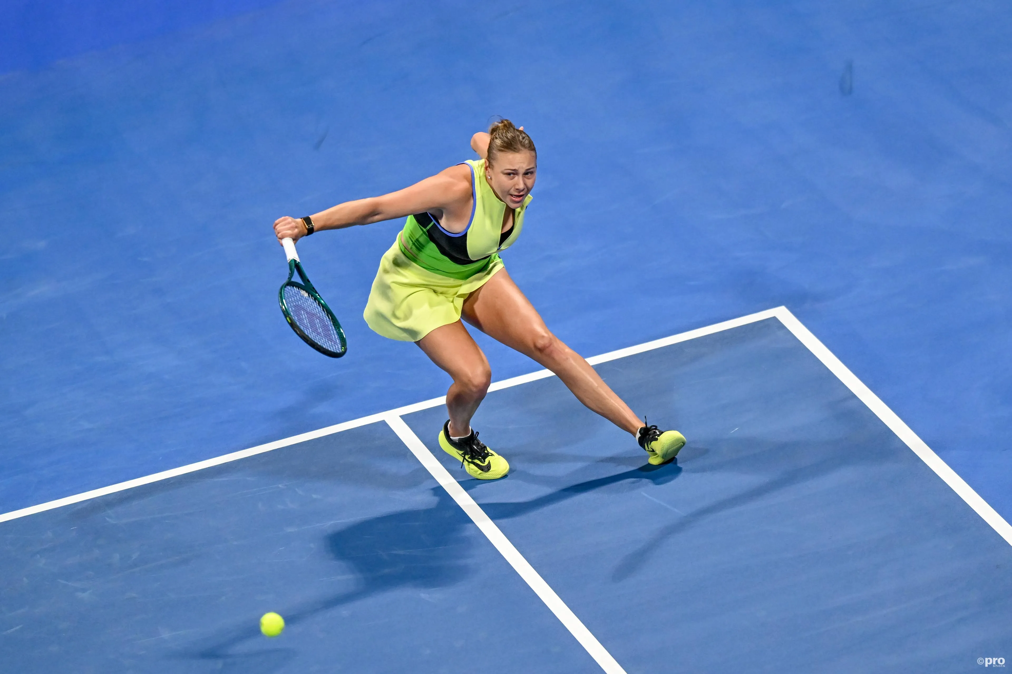 Anisimova swats return.