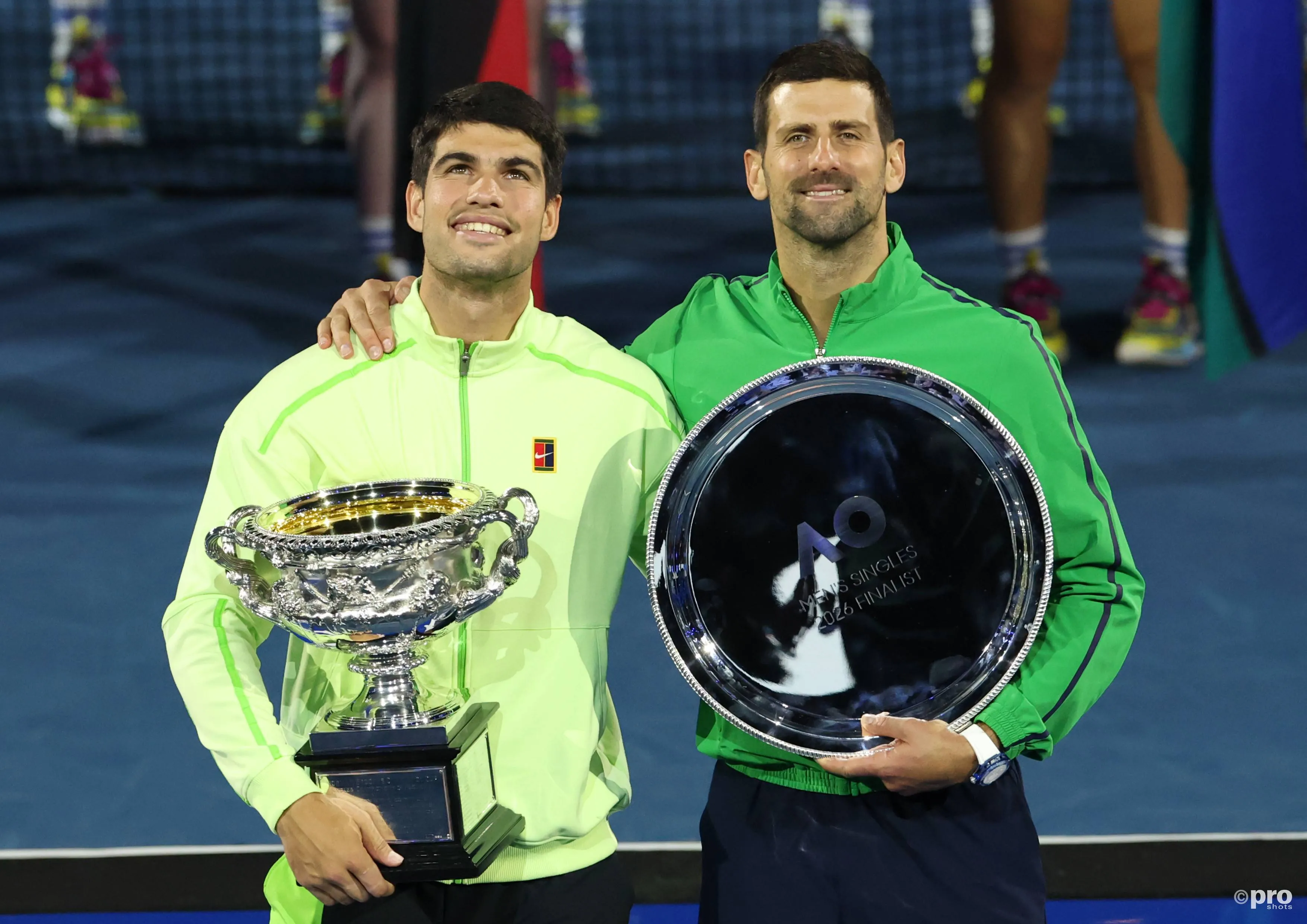 carlos-alcaraz-and-novak-djokovic-with-their-australian-open-trophies