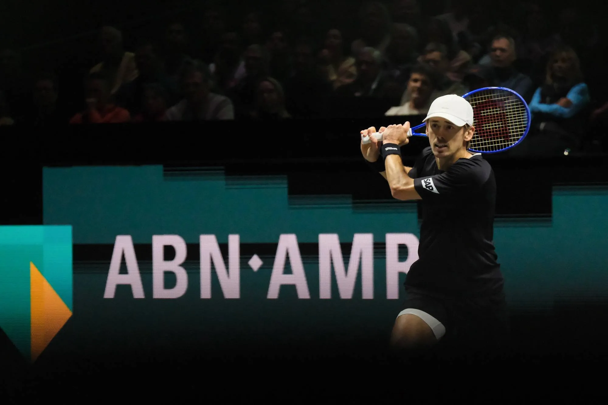 Alex de Minaur returns.