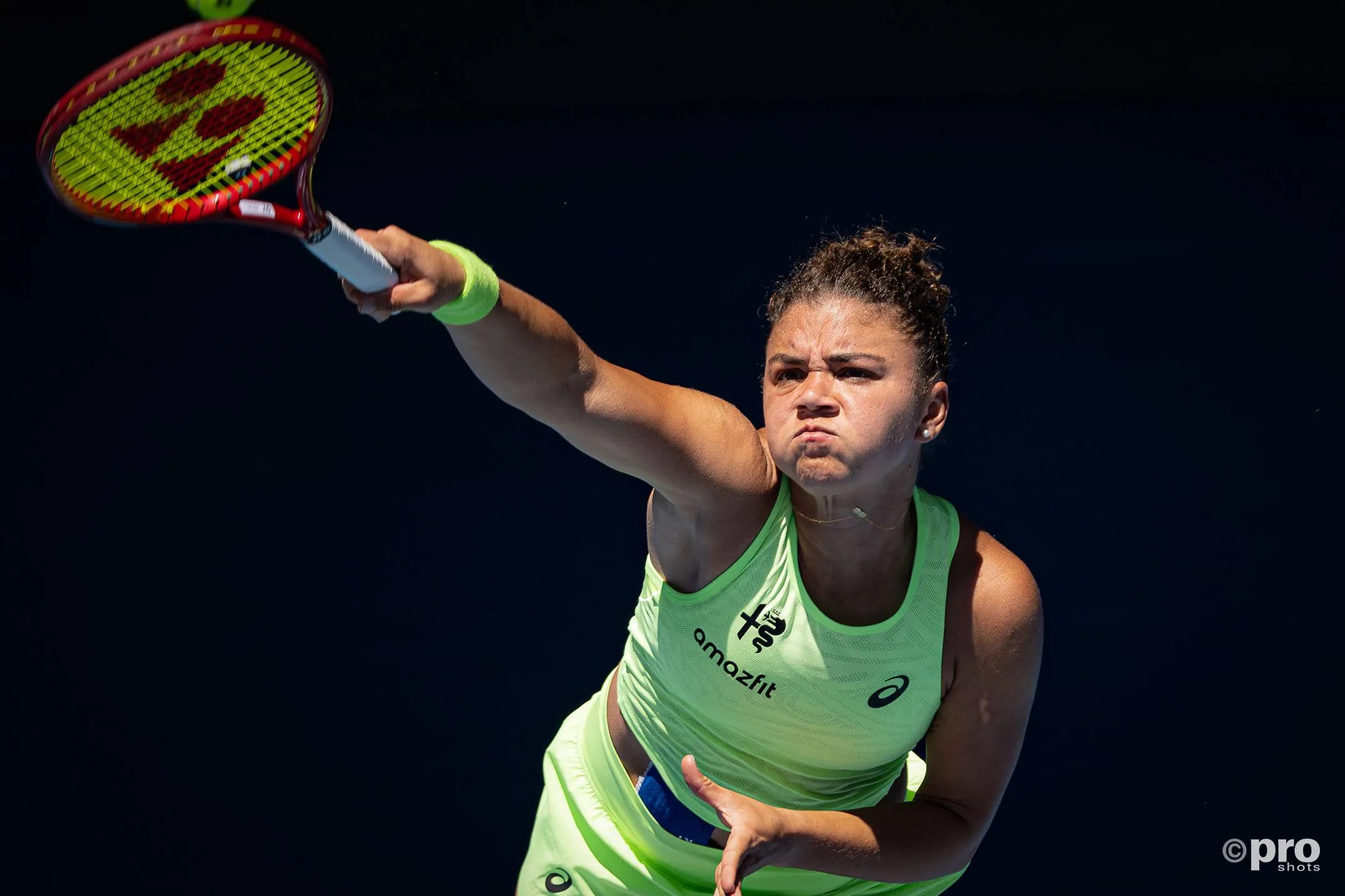 Jasmine Paolini serves.