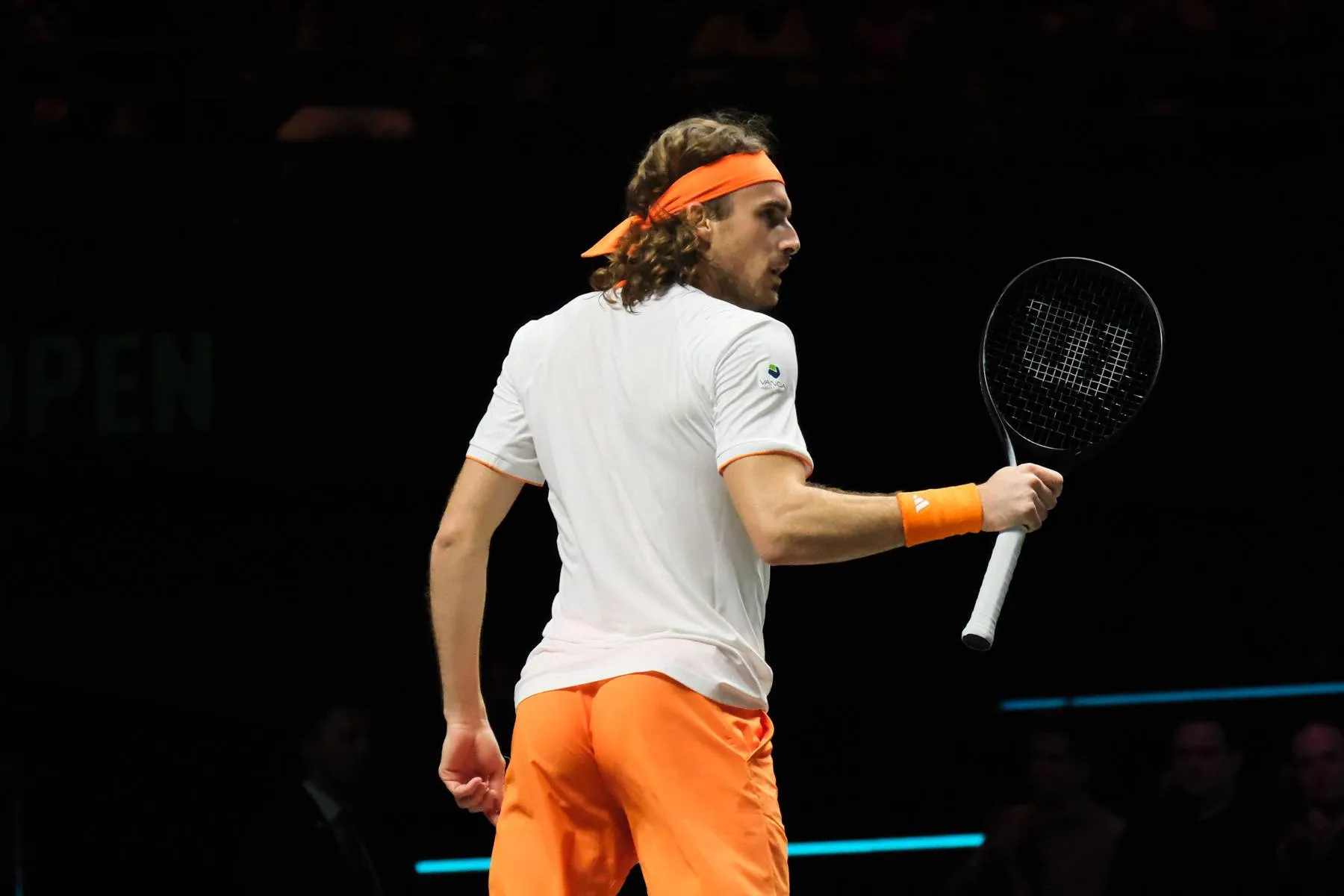 Stefanos Tsitsipas raises racket