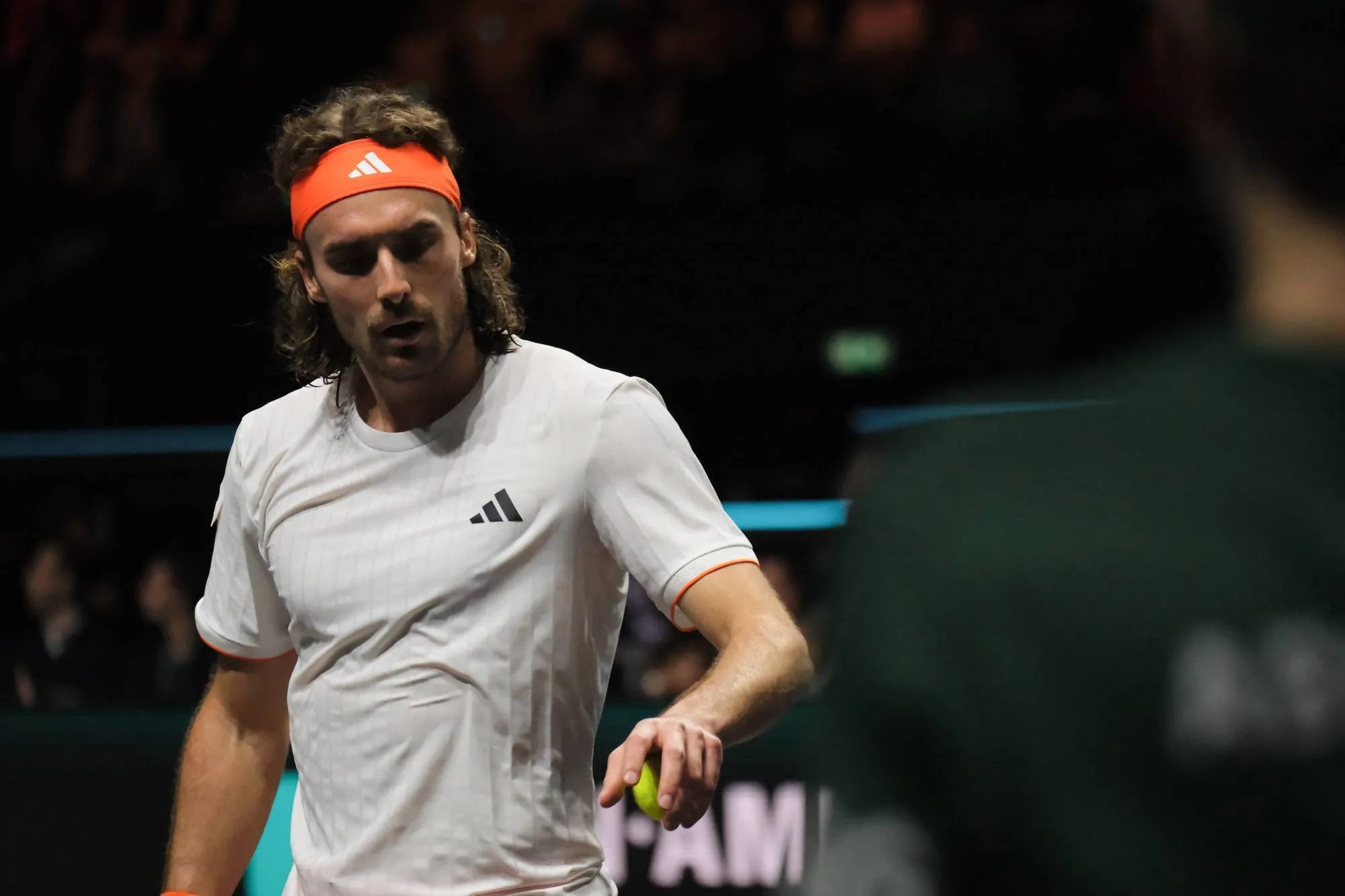 Stefanos Tsitsipas receives ball.