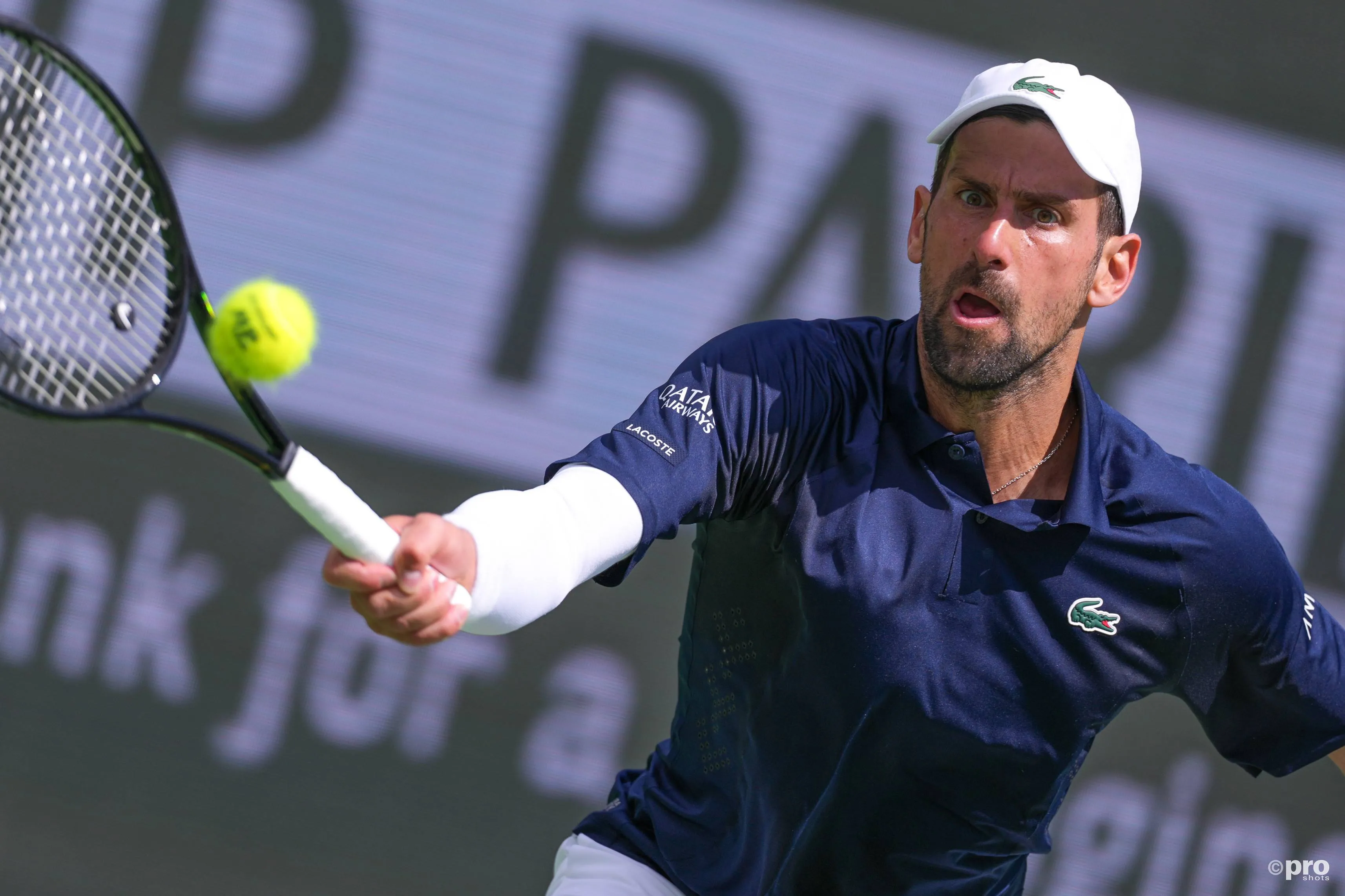 Novak Djokovic returns during IW tie.