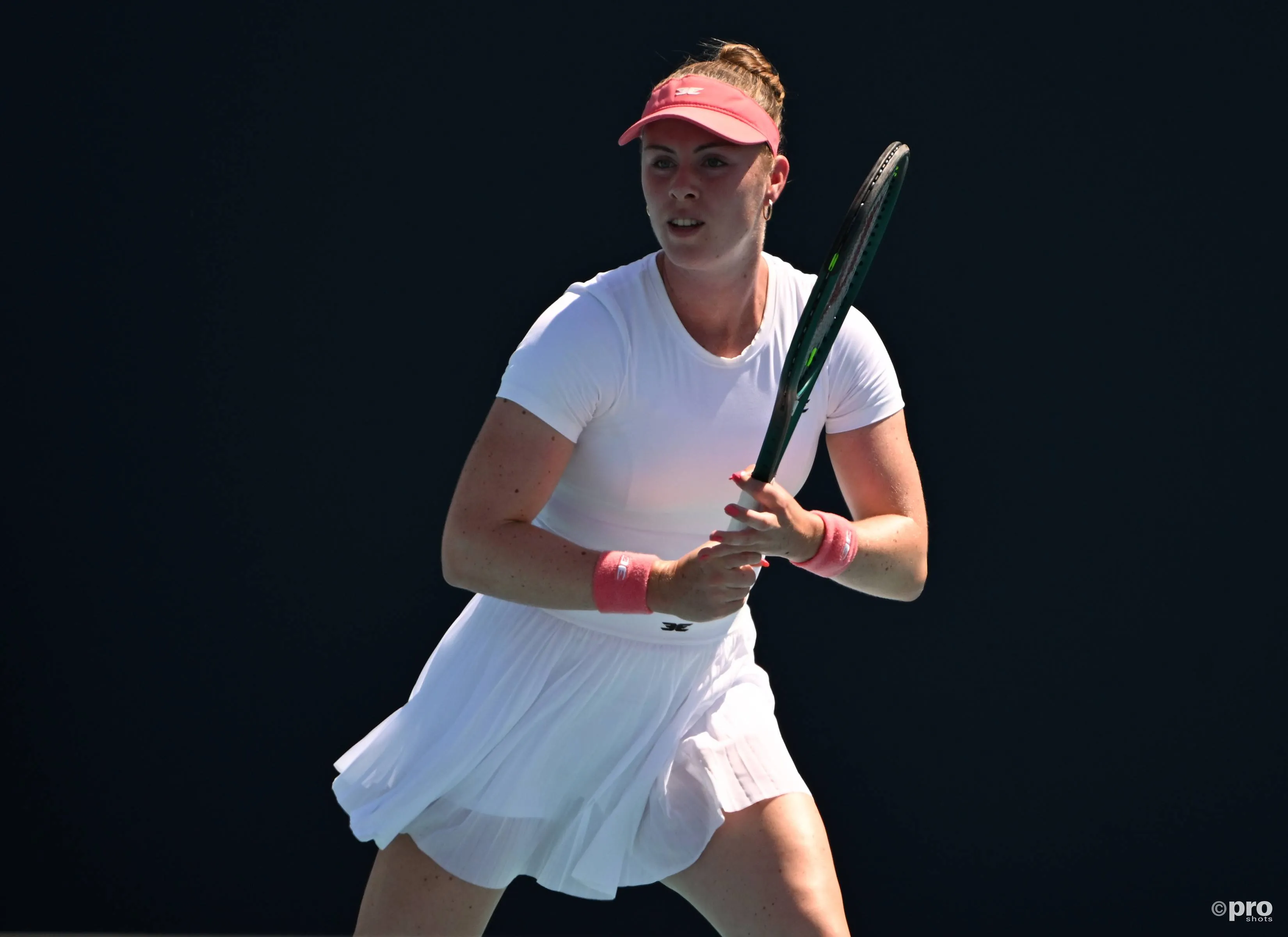 Talia Gibson readies racquet.