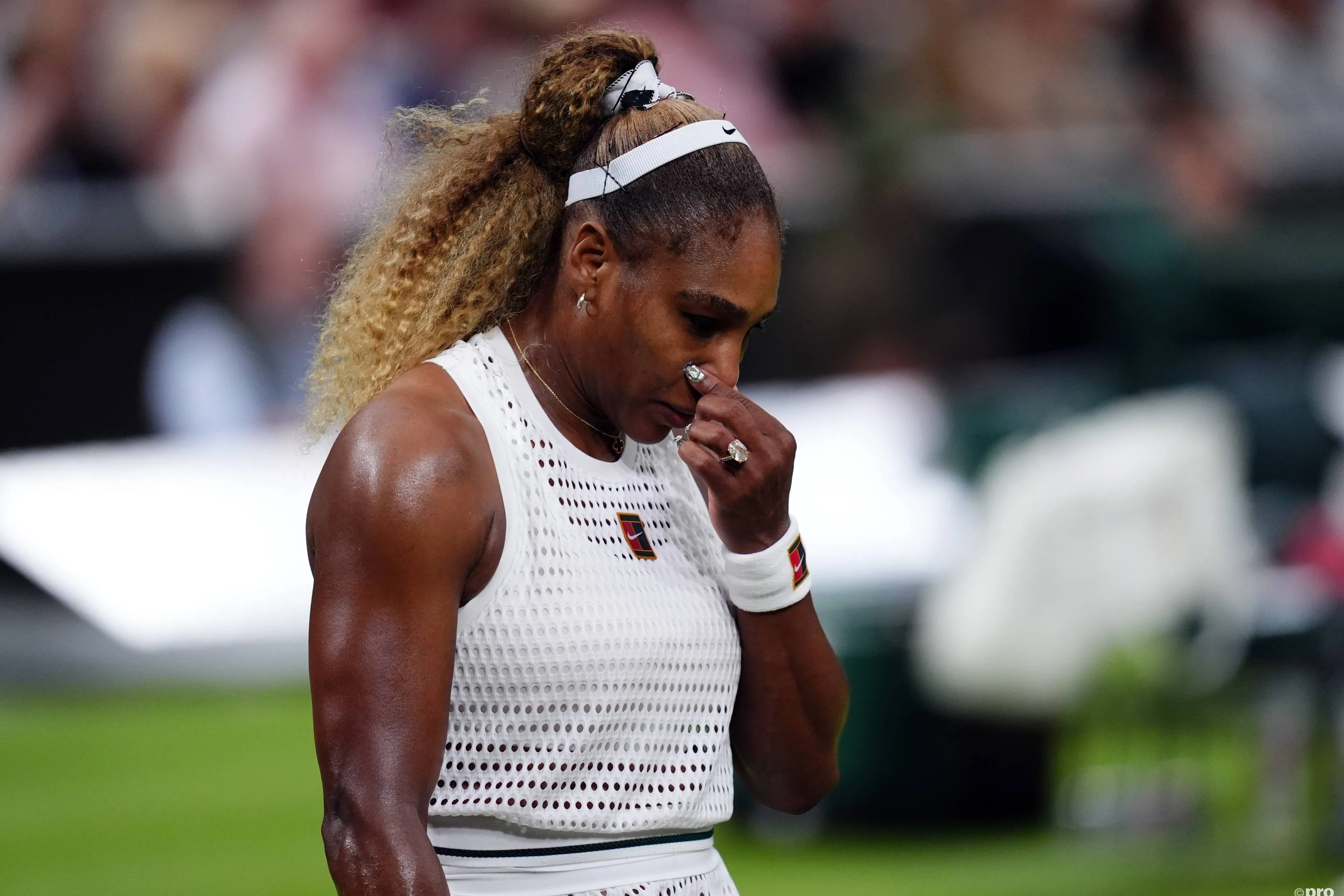 Serena holds nose.
