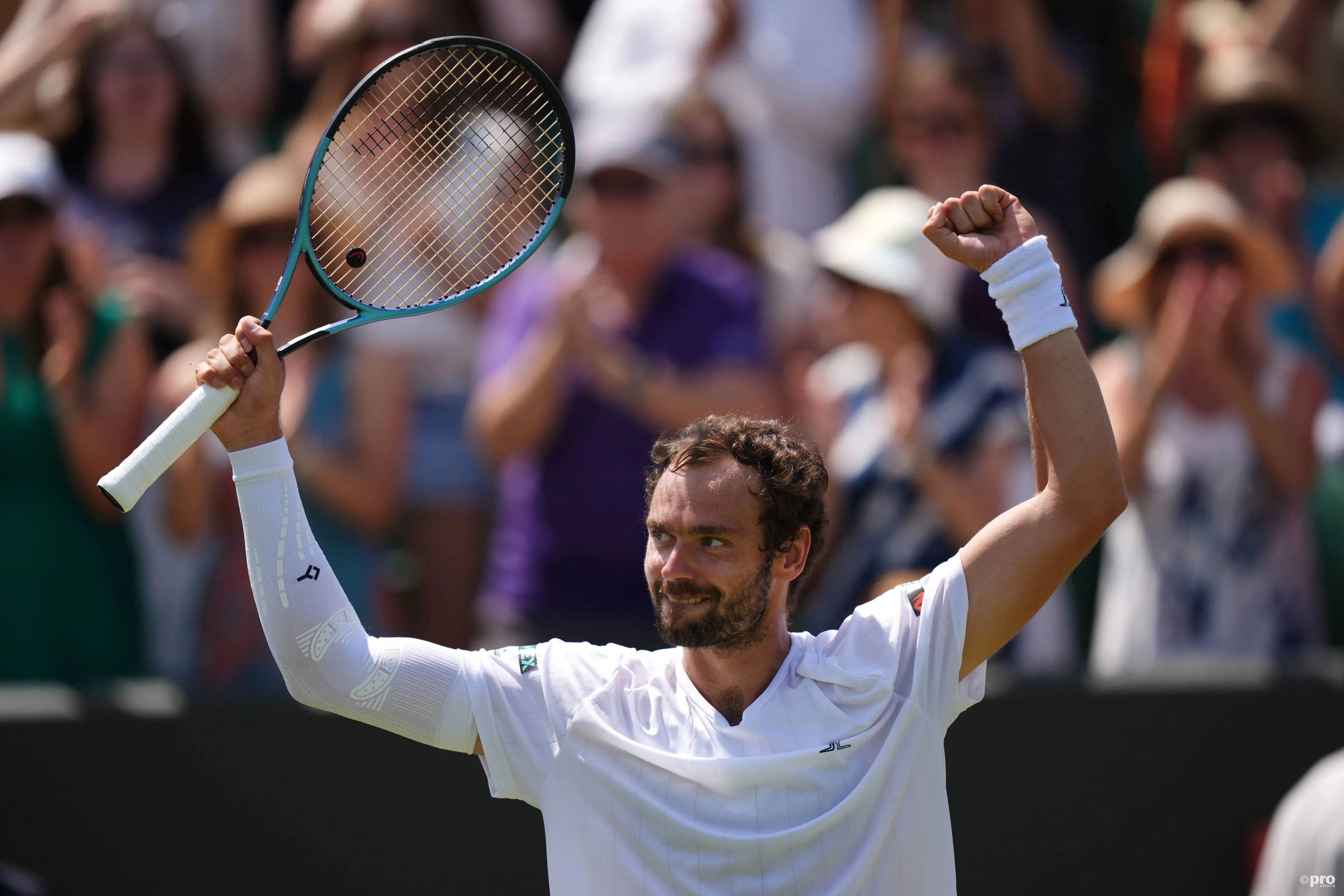 Roman Safiullin raises arms.