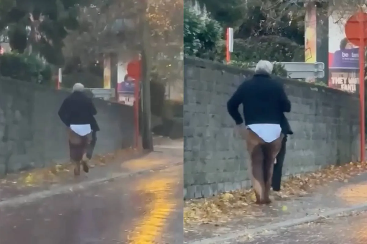 thumb_vk_Burgemeester_van_Sint_Truiden_loopt_laveloos_door_de_straat_met_natte_broek_en_al