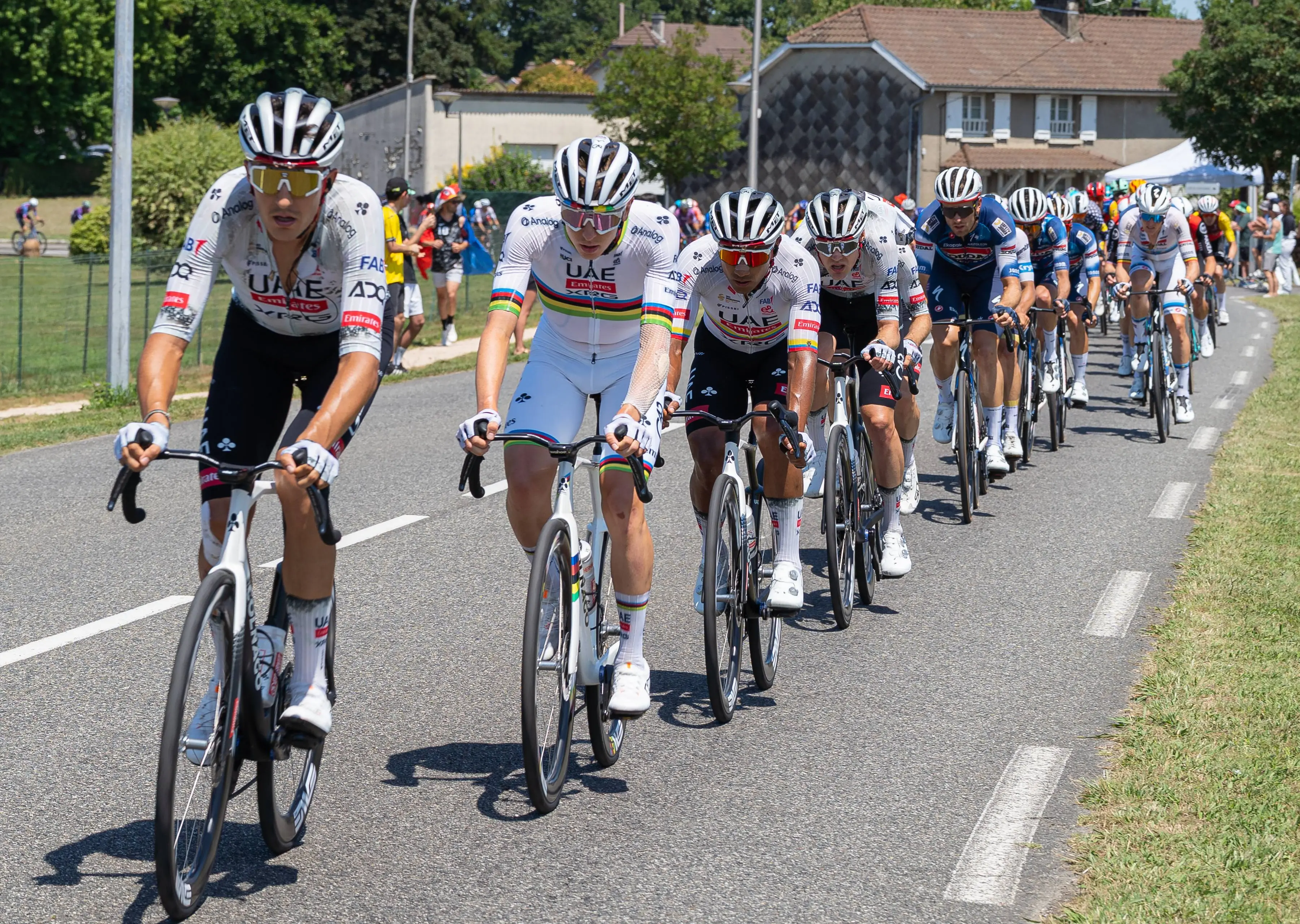Tadej_Pogacar_in_the_peloton_of_Tour_de_France_2025_stage_12
