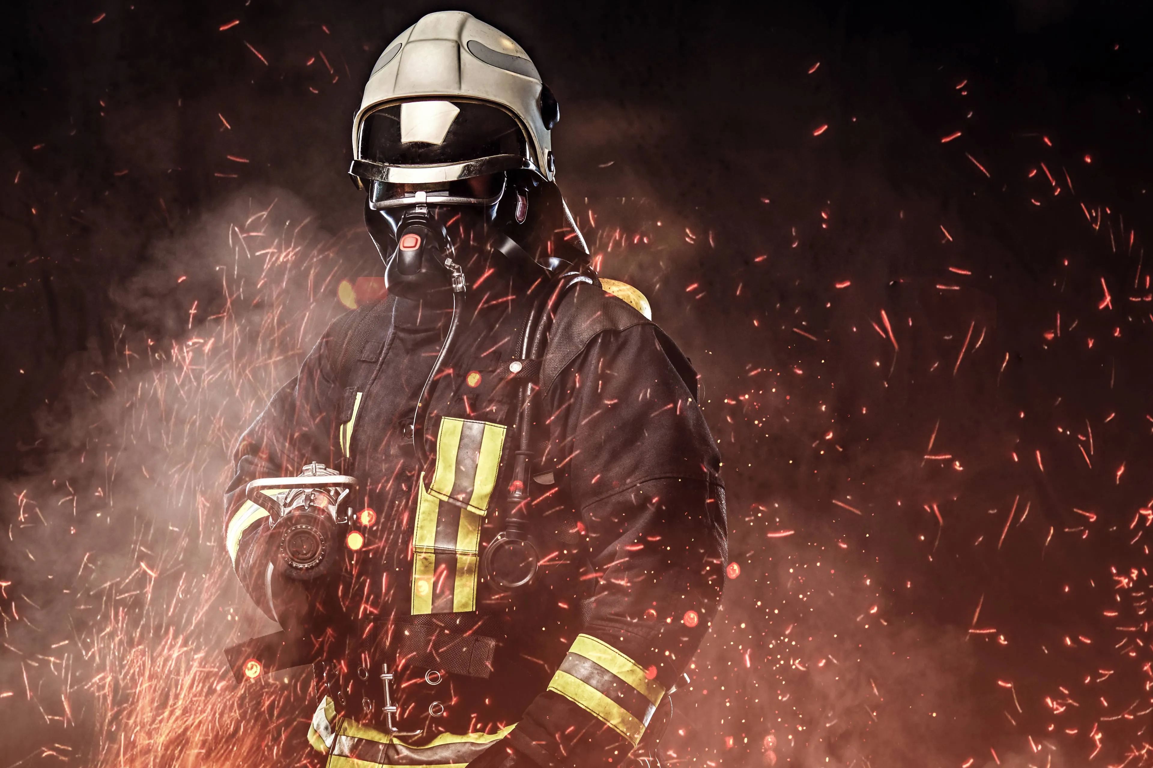 professional-firefighter-dressed-uniform-oxygen-mask-standing-fire-sparks-smoke-dark-background