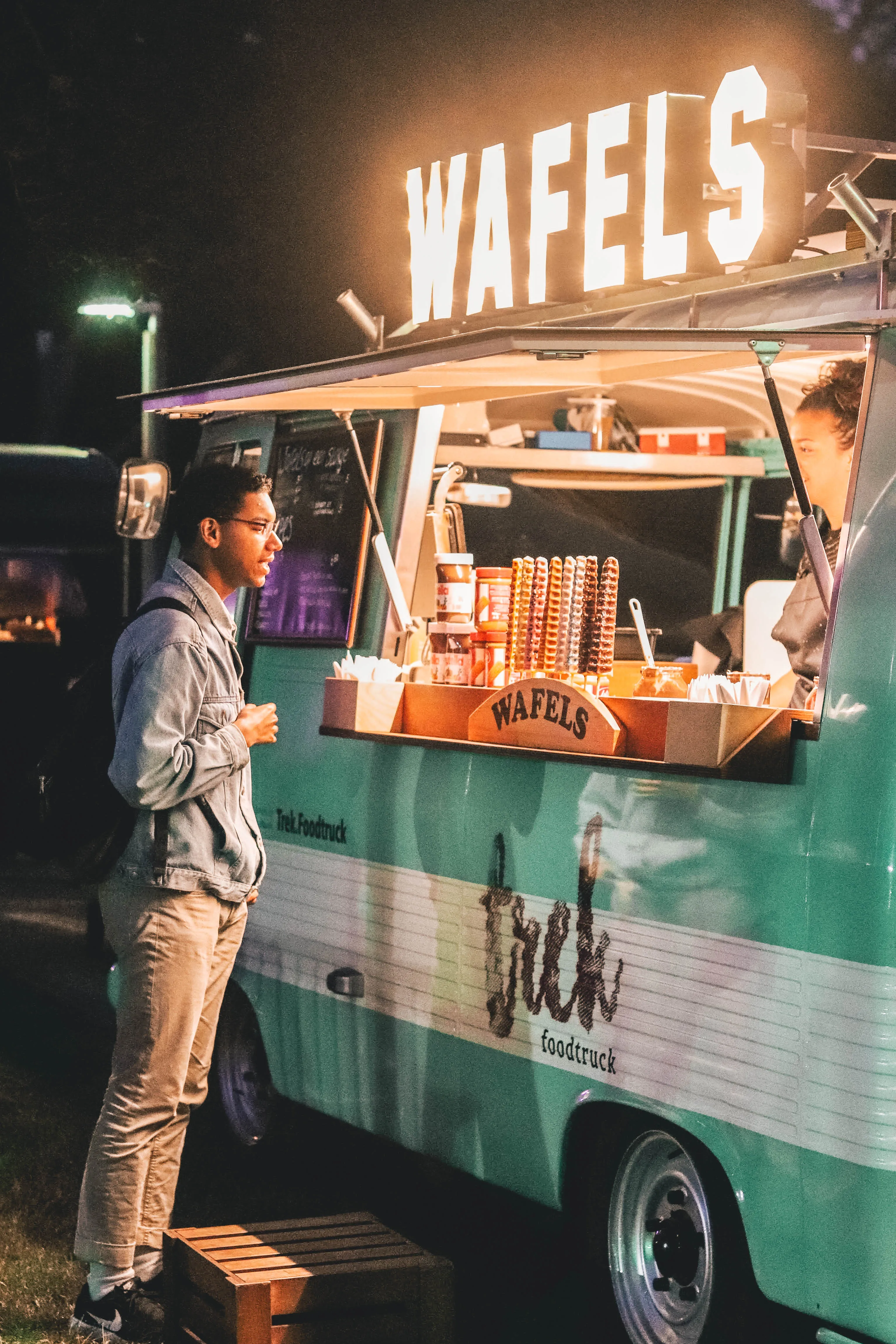 canva man standing near food truck