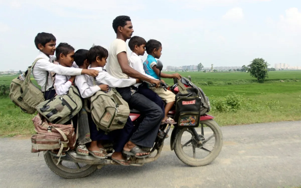 a man and six children share one motorcycle in indias uttar pradesh province