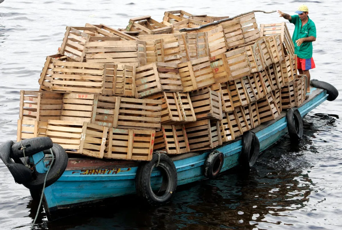 a riverboat in amazonas brazil is overloaded with empty boxes