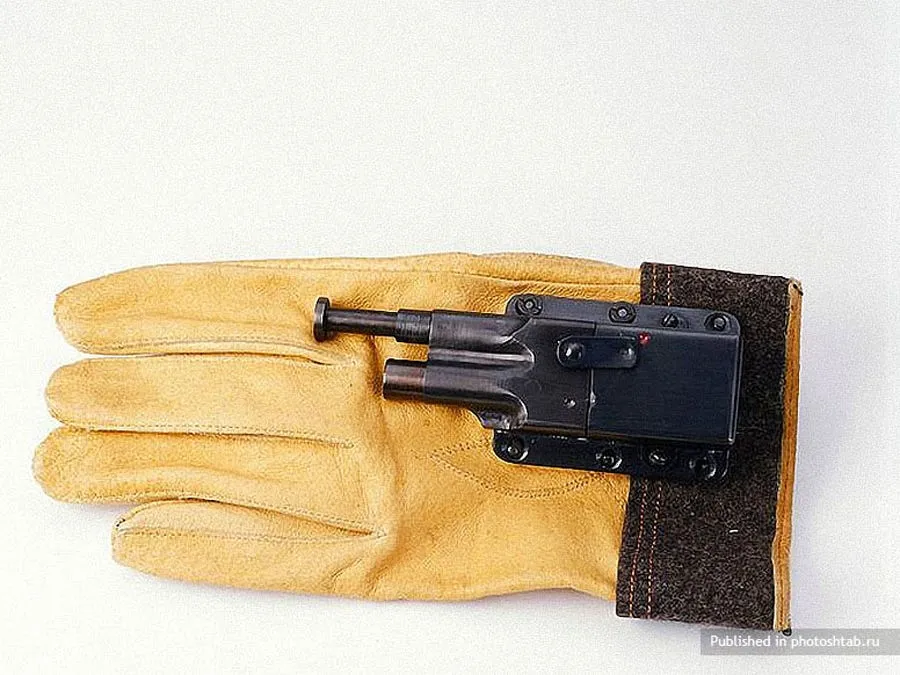 a tiny gun hidden on the inside of a glove