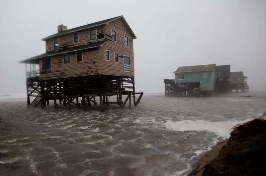 abandoned beach front houses are surrounded by rising water as the effects of hurricane irene are felt in nags head nc