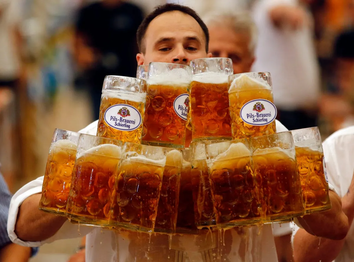 german oliver stuempfl competes to set a new world record for carrying one liter beer mugs over a distance of 131 feet on sept 7 struempfl carried 27 mugs to set a new world record