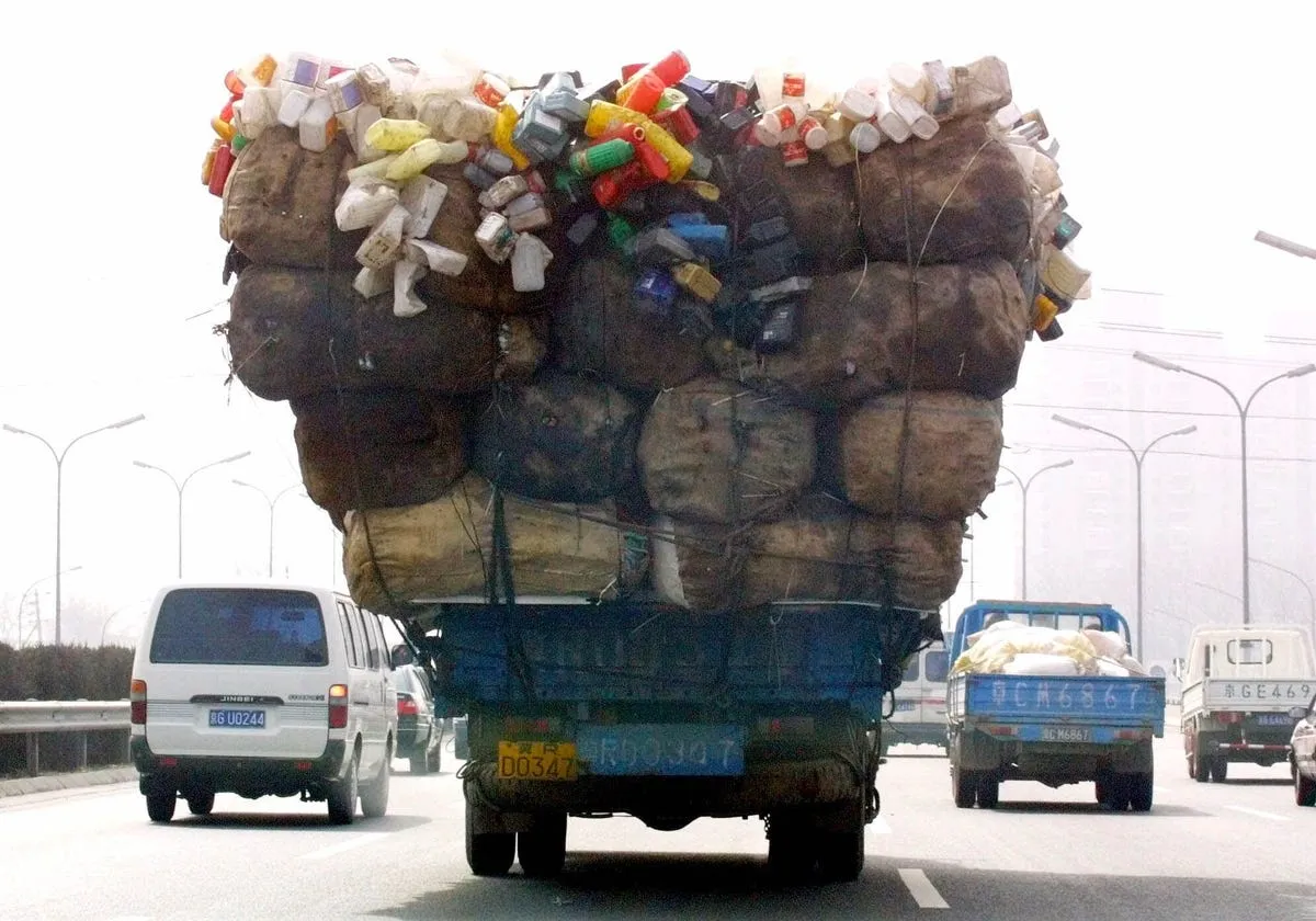 heres a chinese truck carry a wide load down a road