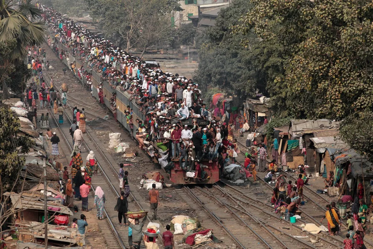 other dhaka residents use the roof of the train as well as its interior