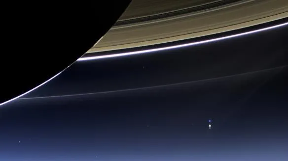 this humbling photo taken by nasas cassini spacecraft in 2013 shows what earth indicated by the tiny white arrow looks like from 898 million miles away 584x328