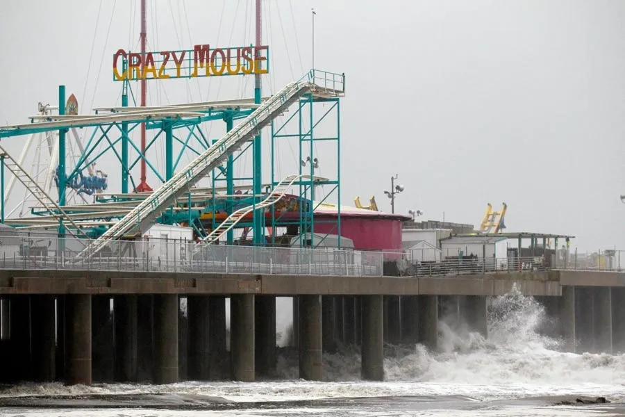 waves crash against the steel pier nj before hurricane irene