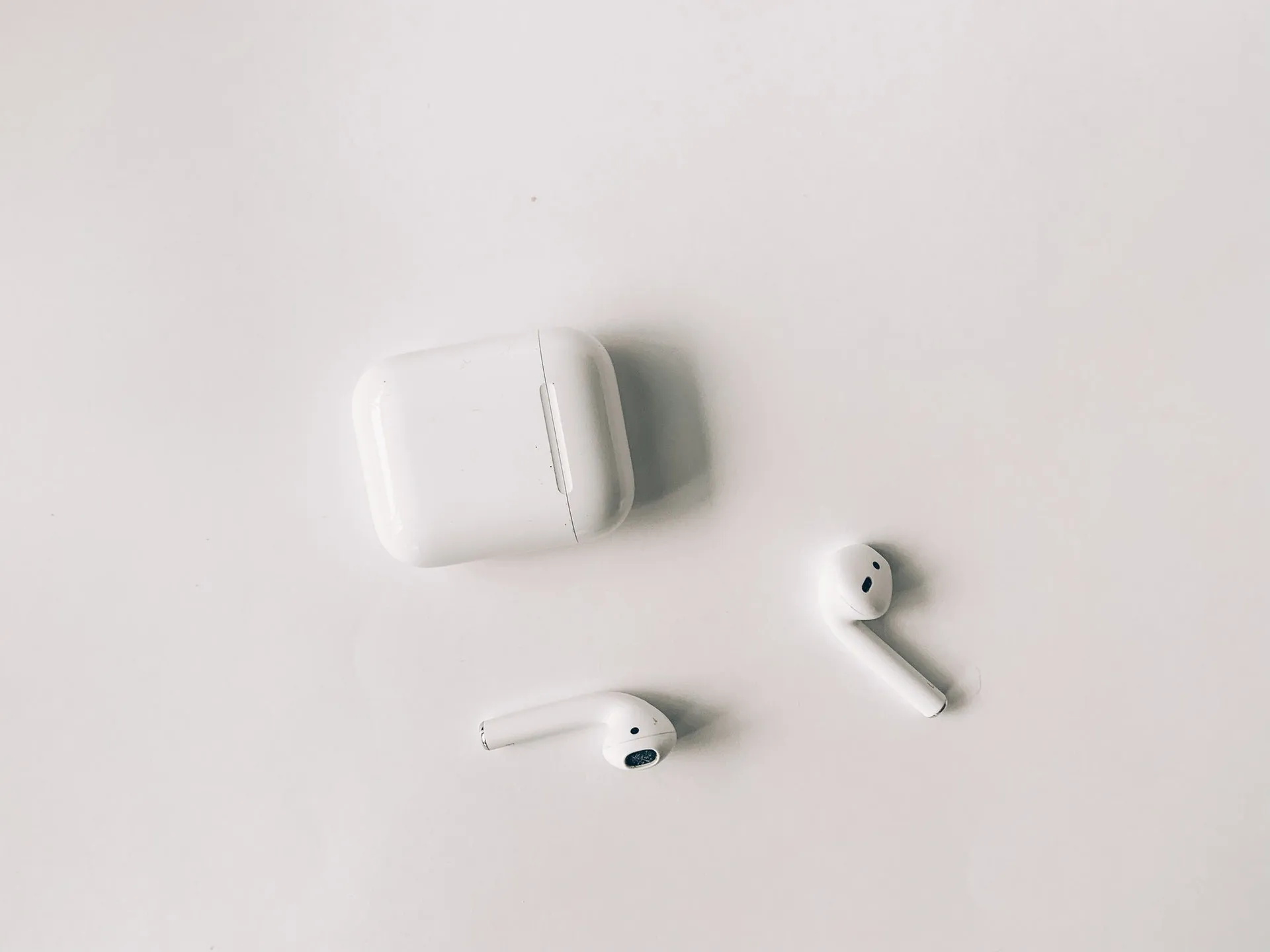white apple airpods on white table 3825517f1603728072