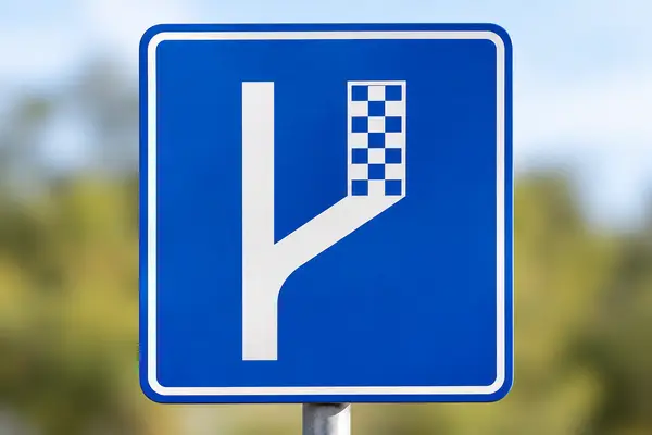 Blue Road Sign with Checkered Exit