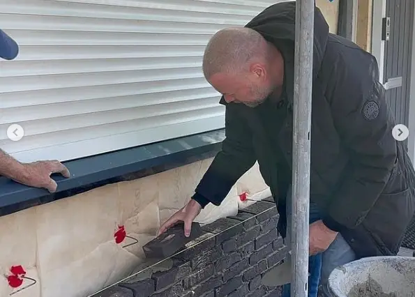Van Barneveld works as bricklayer on repair work at home: 'Brick by brick we are getting to the final result'