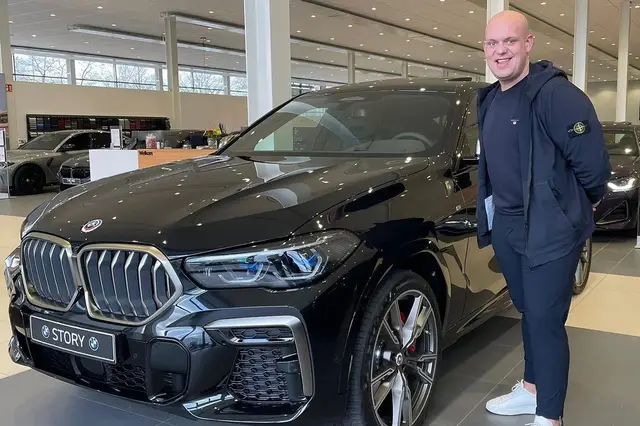 PHOTO: Van Gerwen shows off his brand new BMW X6 M50i