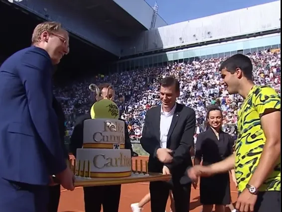(VIDEO) "So big it takes four men to carry it onto court": Alcaraz receives huge cake on court on 20th birthday after reaching Madrid Open final