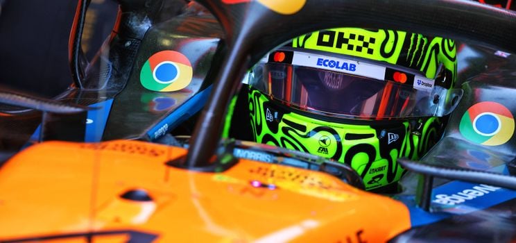 norris helmet mclaren car