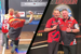 VIDEO: Daryl Gurney has to throw darts while Nathan Aspinall sits on his knee