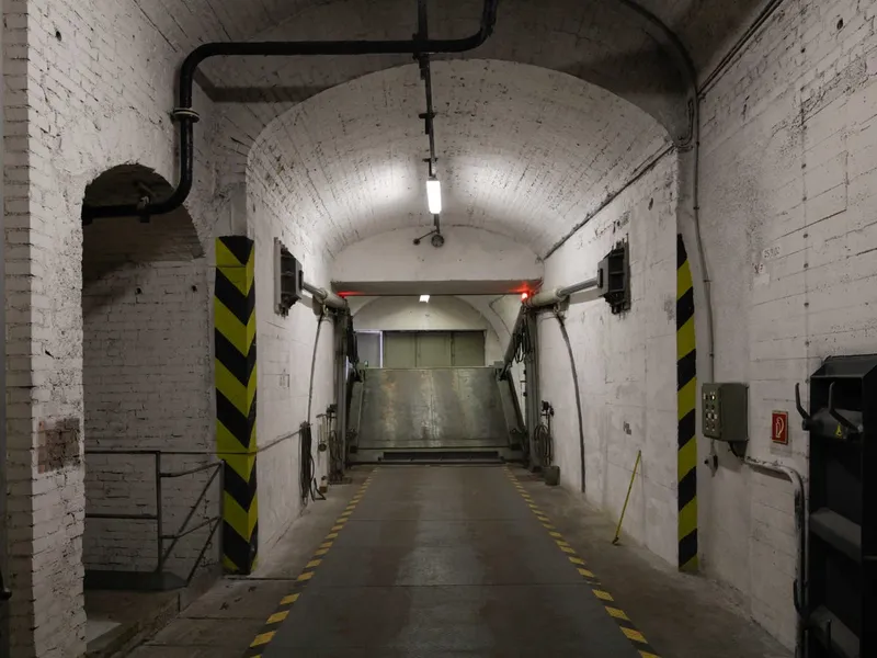 complete with blast doors and protective corridors the shelter is said to be able to withstand nuclear blasts direct plane crashes biological and chemical agents earthquakes and any armed attacks
