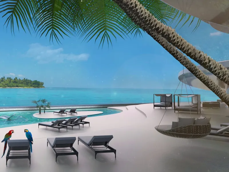 the real draw is the beach deck replete with multiple pools barbecue areas underwater dining a shark feeding station and an outdoor cinema